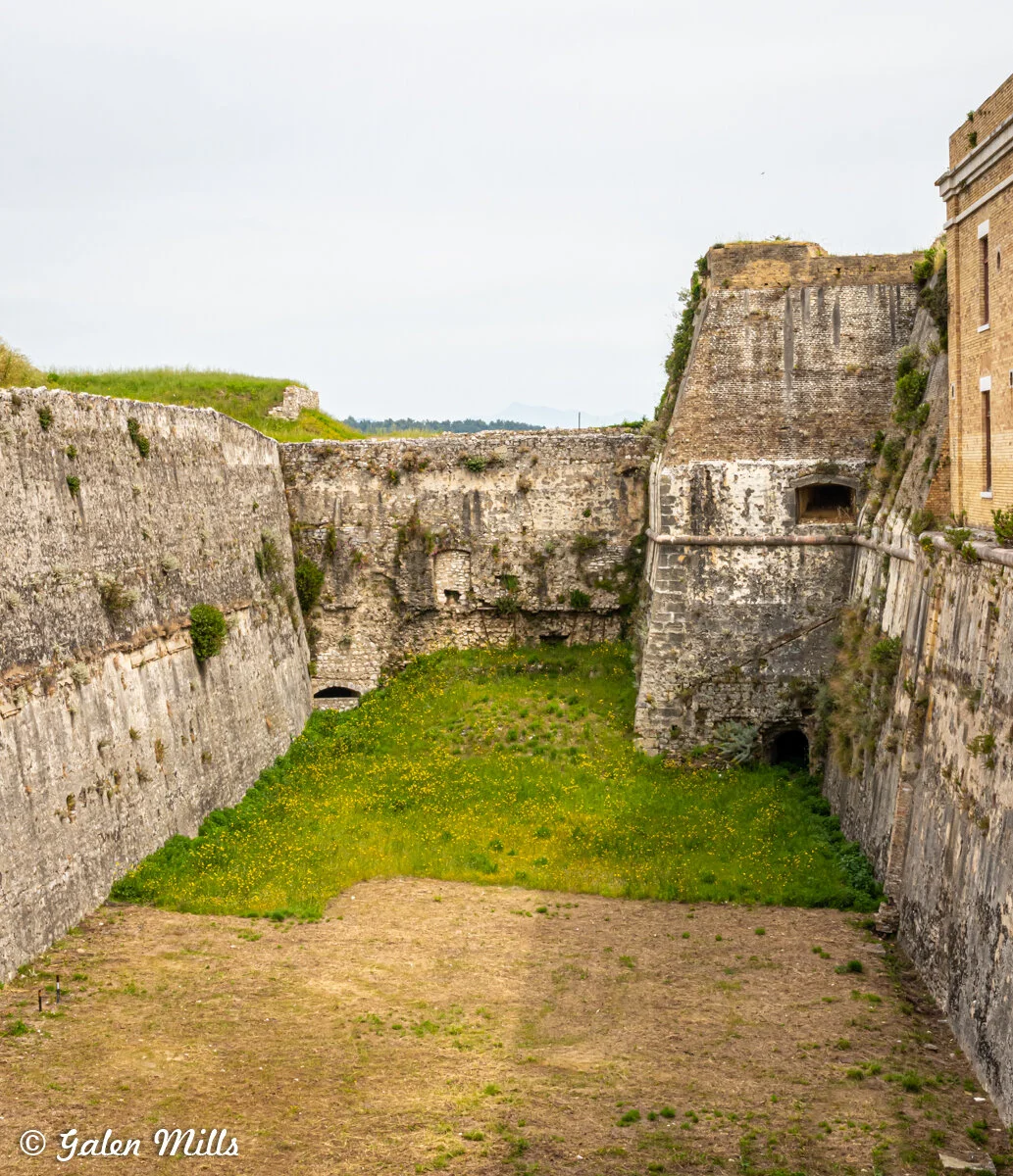View of an old stone fortification with grassy moat