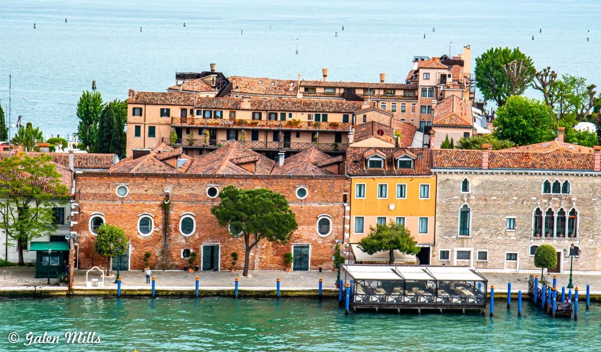 Scenic view of Venice waterfront with historic buildings and canal.