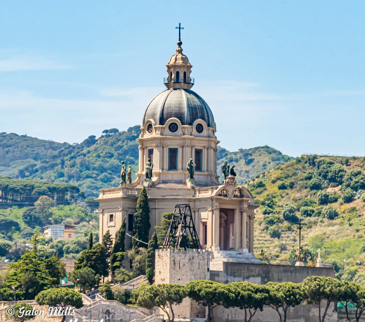 Domed church with statues on roof, surrounded by hills, Messina, Italy