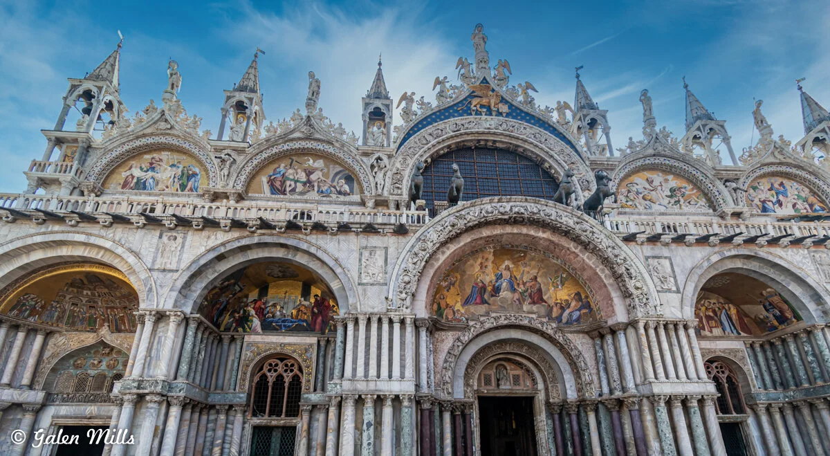 Facade of St. Mark's Basilica with ornate carvings and mosaics in Venice, Italy