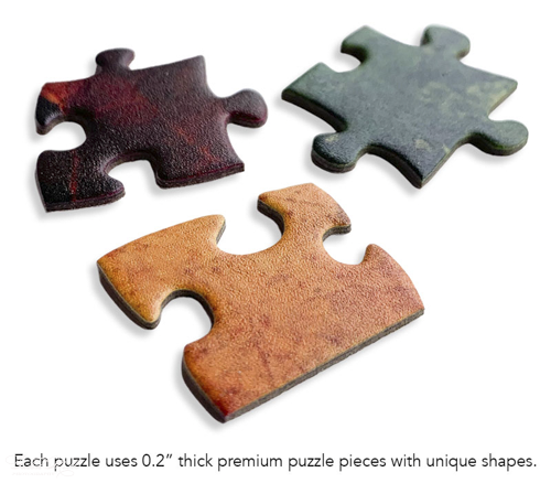 Three puzzle pieces, each a different color, with a textured surface. One is reddish-brown, another dark green, and the third orange.