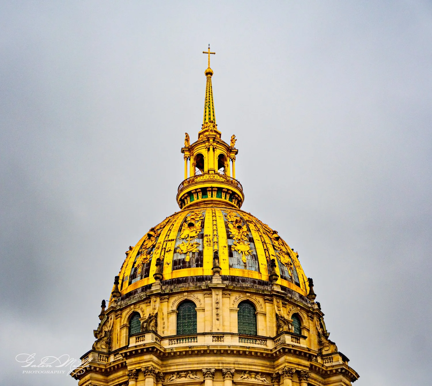 Golden dome of Les Invalides in Paris, cloudy sky