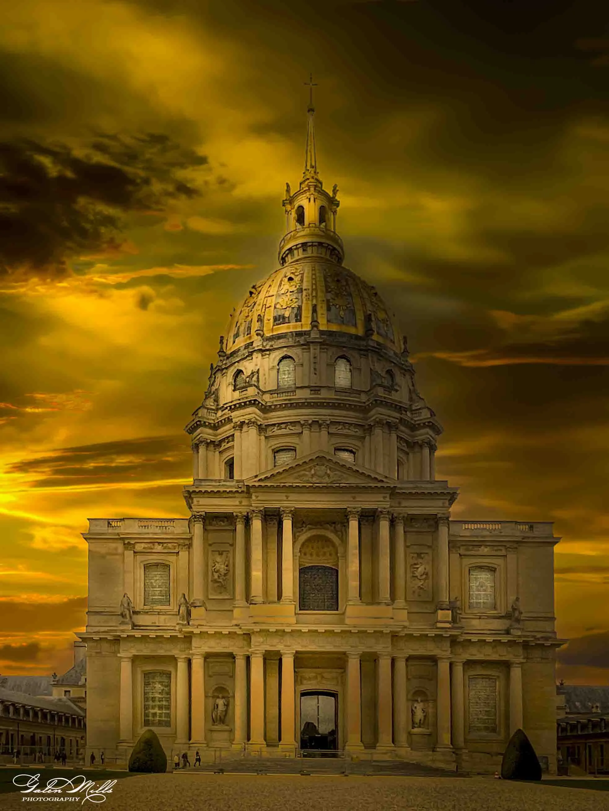 The Dome of Les Invalides in Paris, France against a dramatic, cloudy sky at sunset.