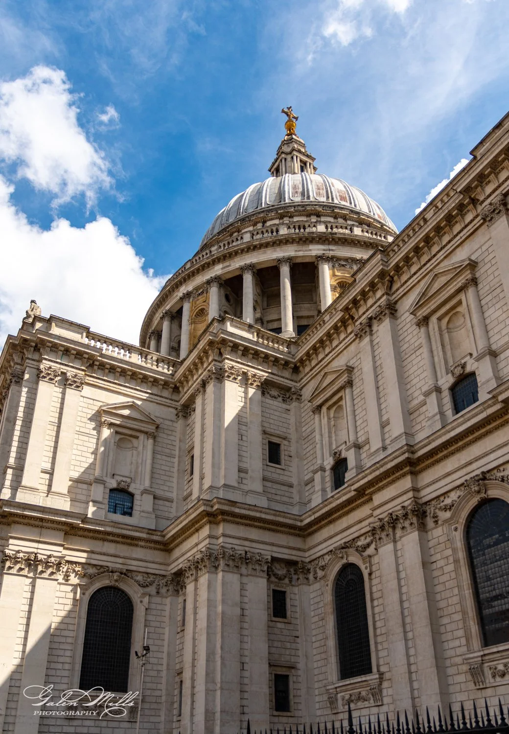 St. Paul's Cathedral dome and facade against blue sky