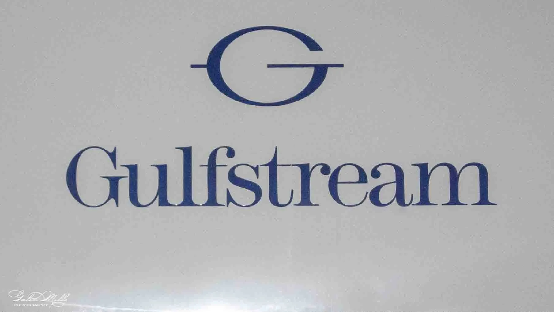 Gulfstream logo on a gray background, with the word "Gulfstream" written below it.