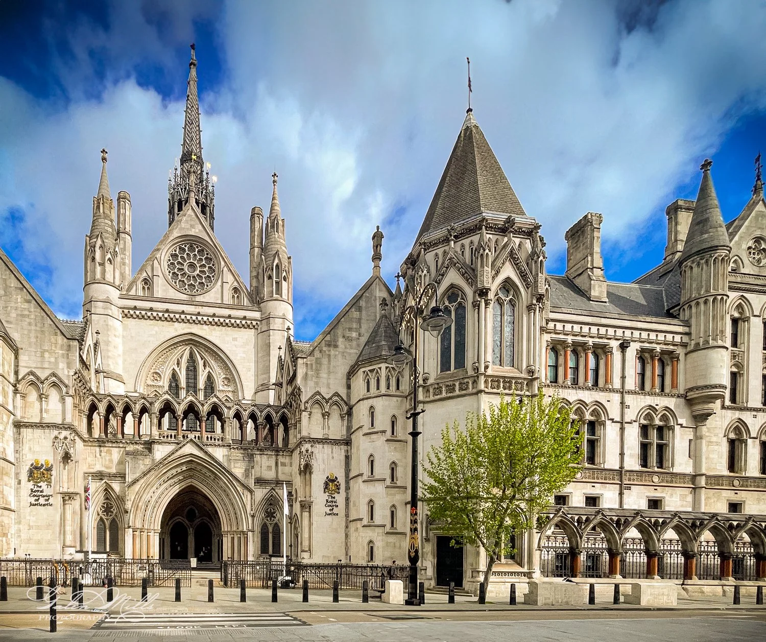 Gothic architectural building with spires and arched windows, featuring ornate facade and details.