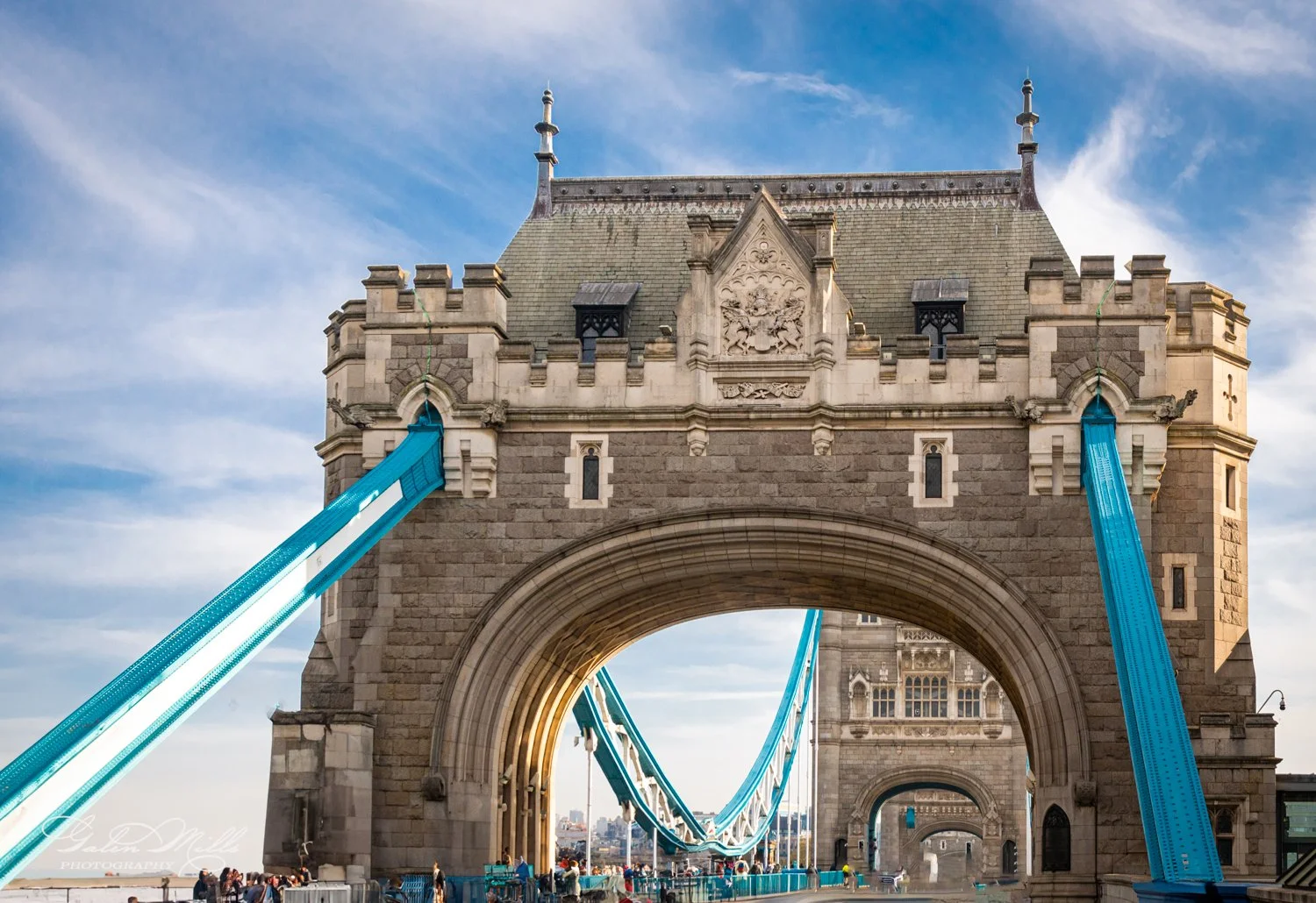 Tower Bridge in London with blue sky and clouds.