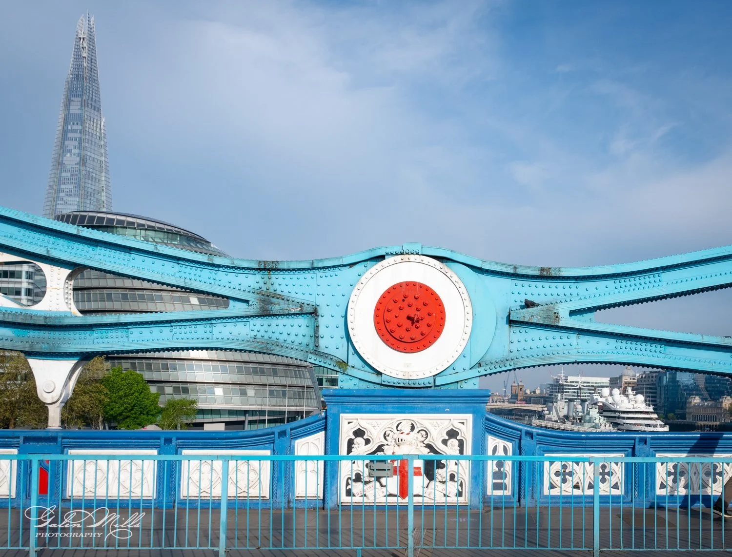 London architecture with Tower Bridge detail, The Shard, and surrounding buildings.