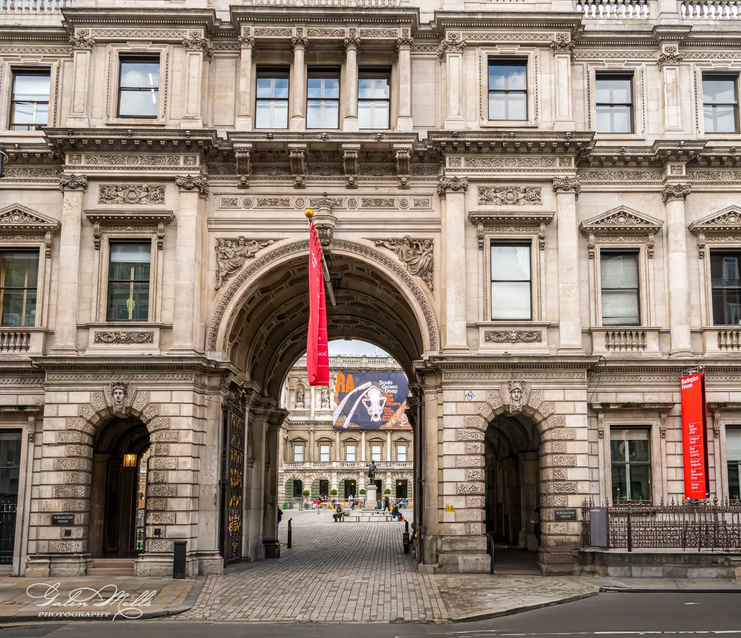 Historical building with ornate stone facade and archways