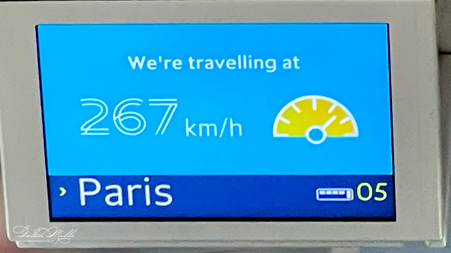 Train speed display showing 267 km/h and destination Paris.