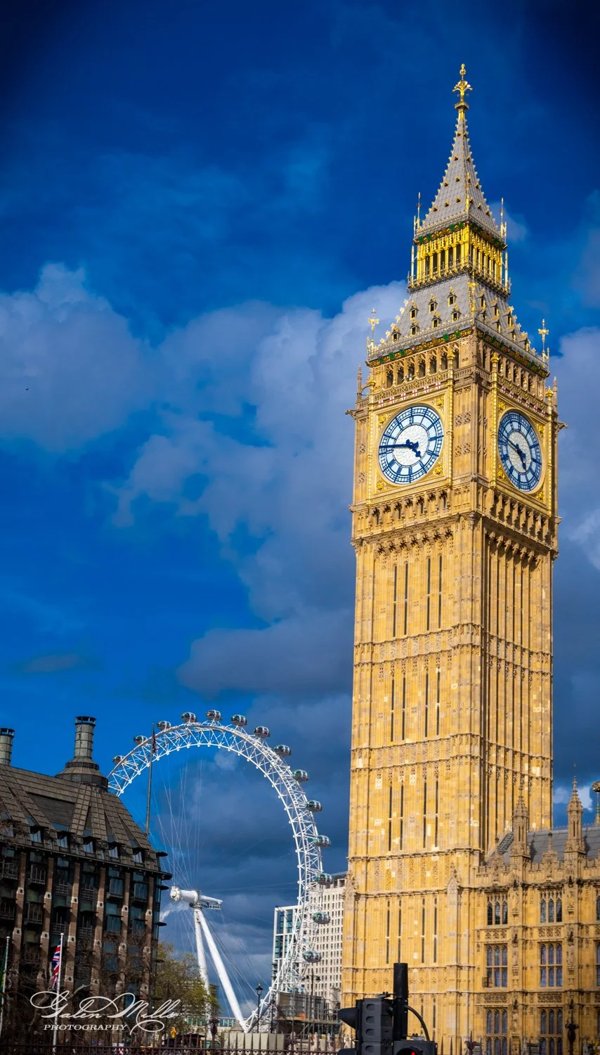 Big Ben and the London Eye against a blue sky