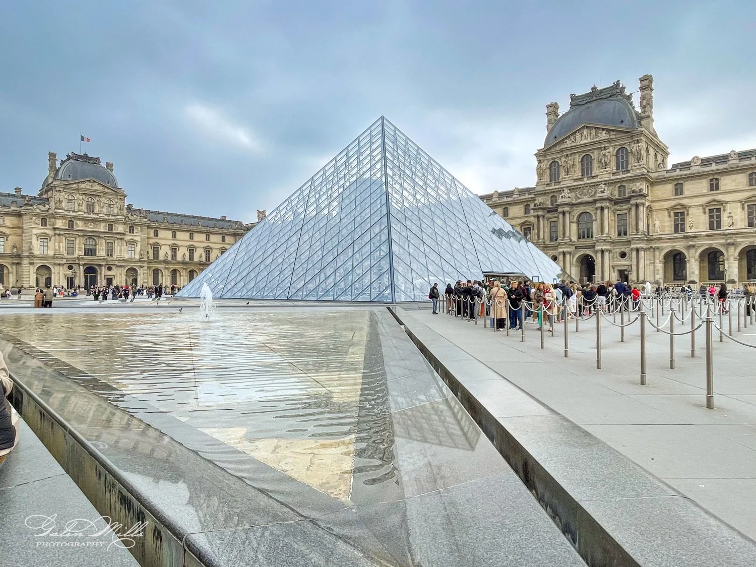 Louvre Pyramid, glass structure, Paris, people, water fountain