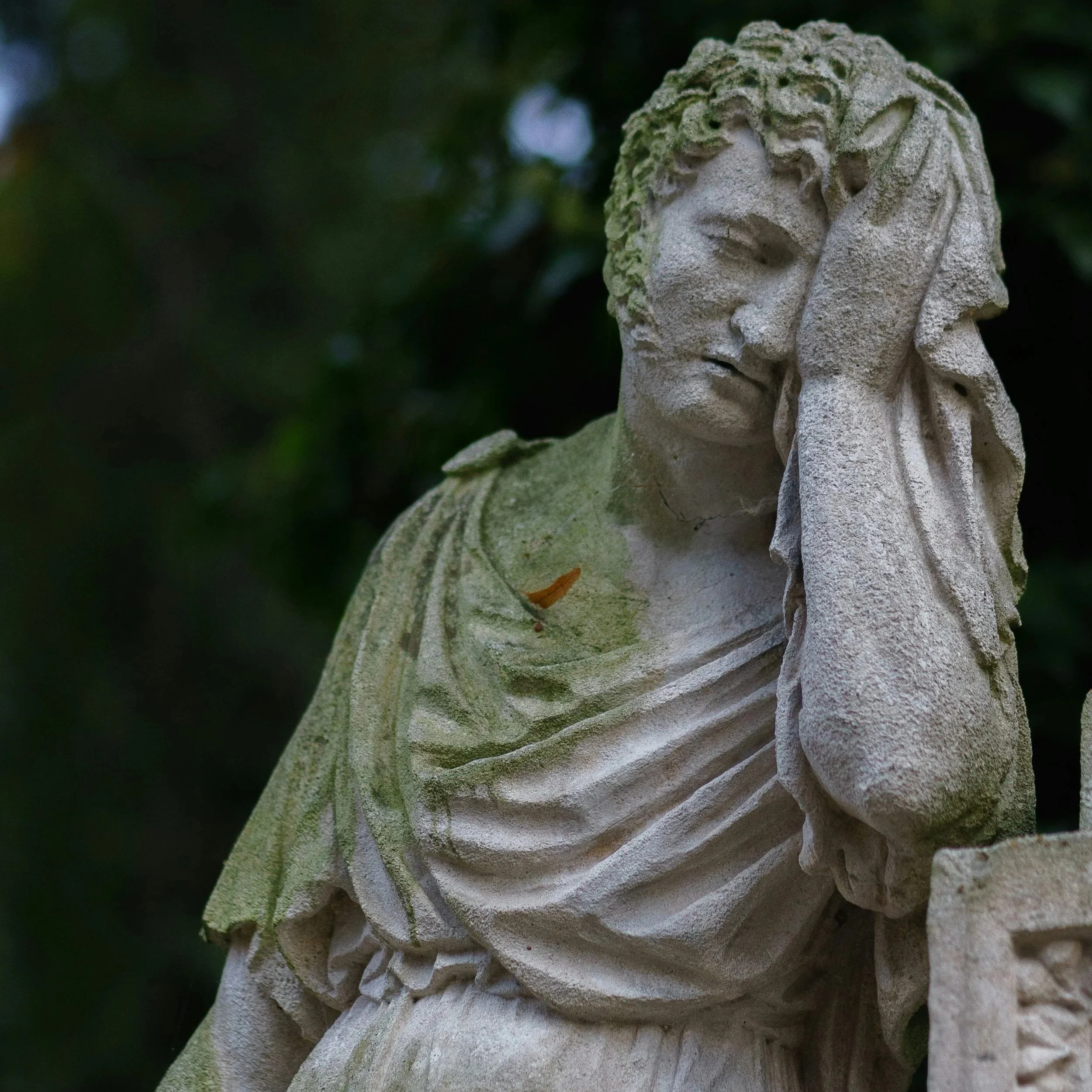 Stone statue looking exhausted