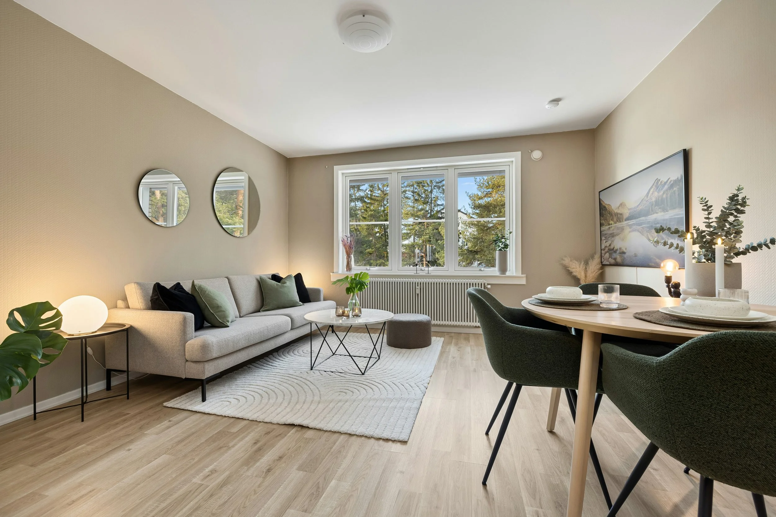 A living room filled with furniture and a large window