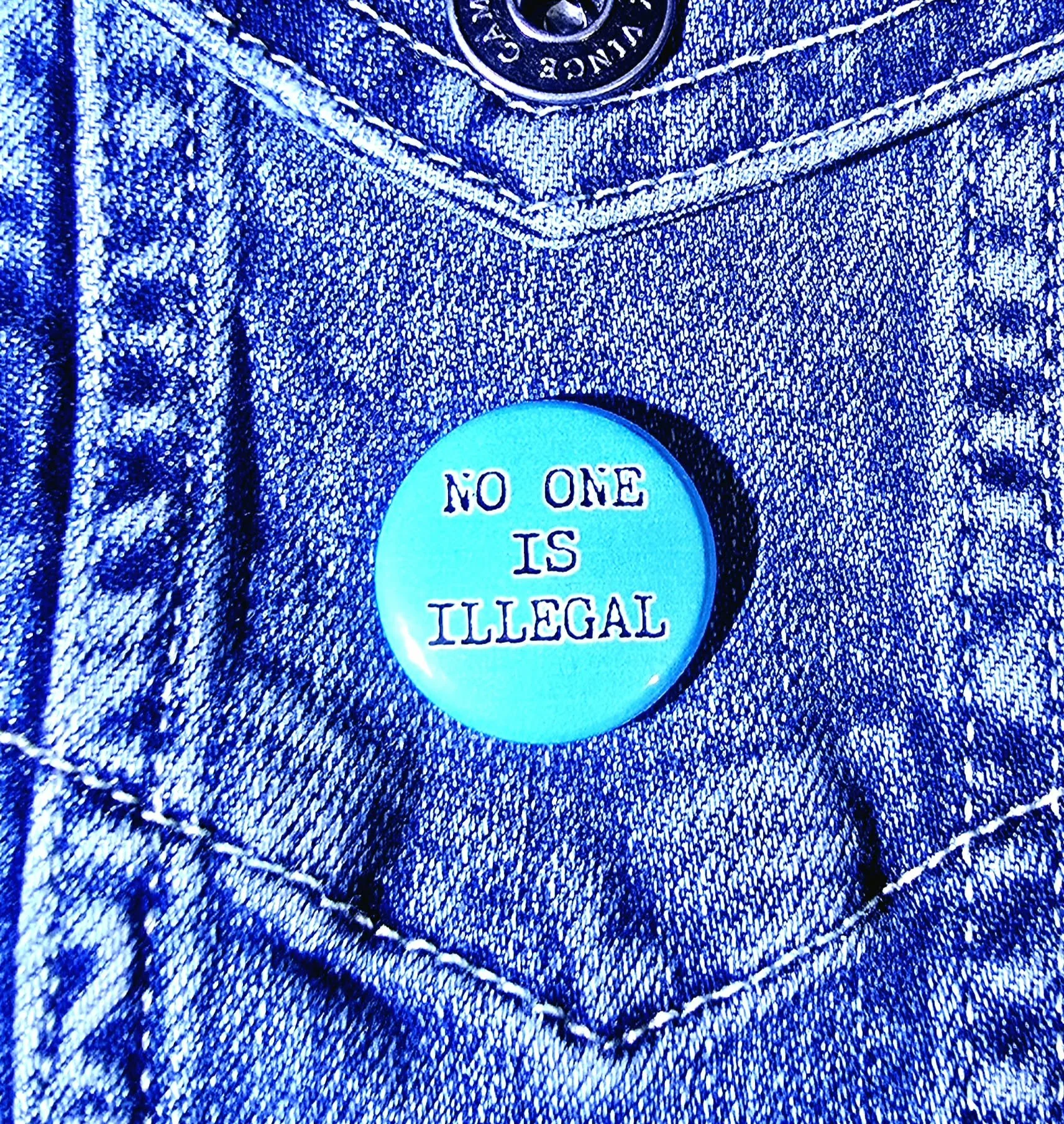 No One Is Illegal Button