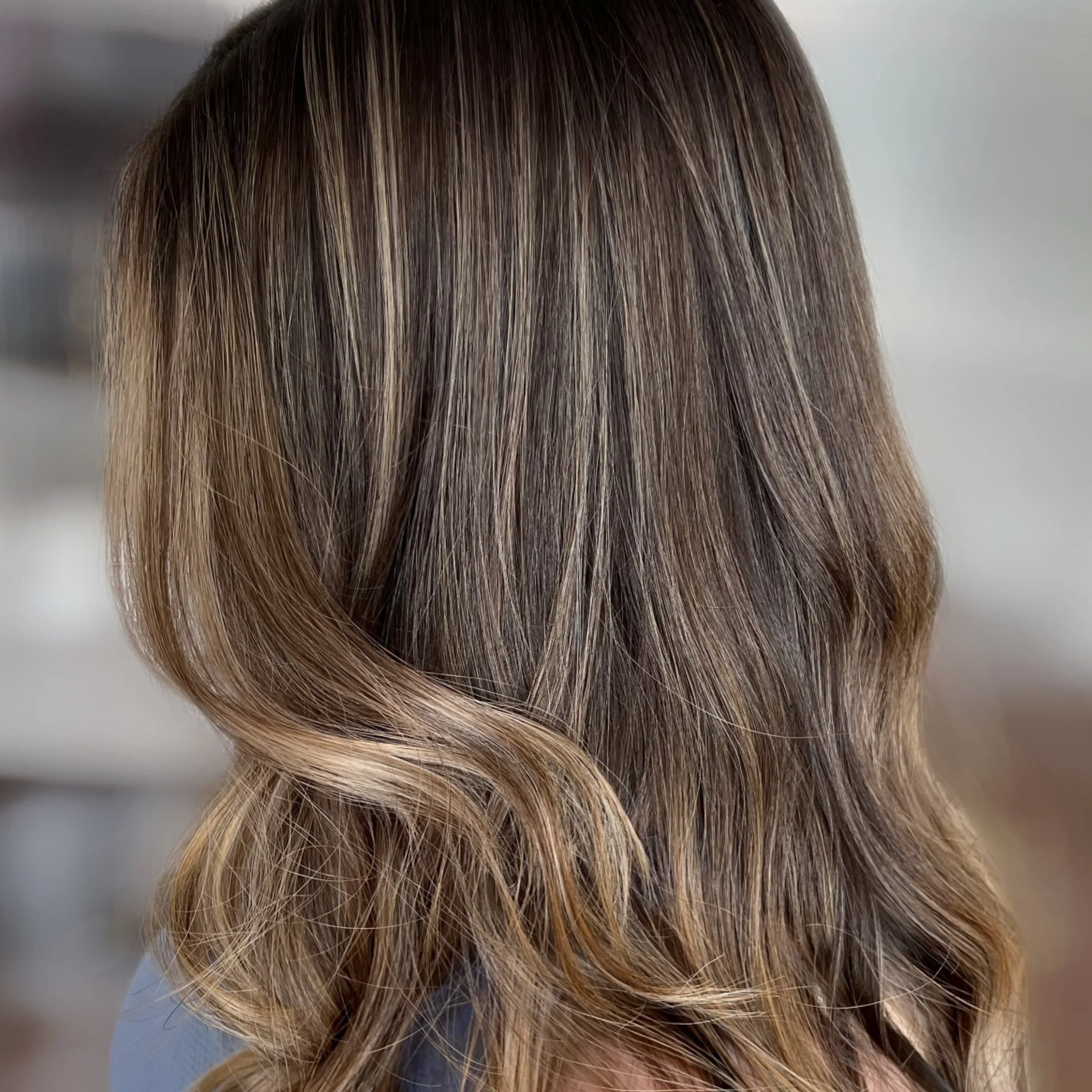 Rich brunette balayage with soft dimension by a Northern Virginia hair salon