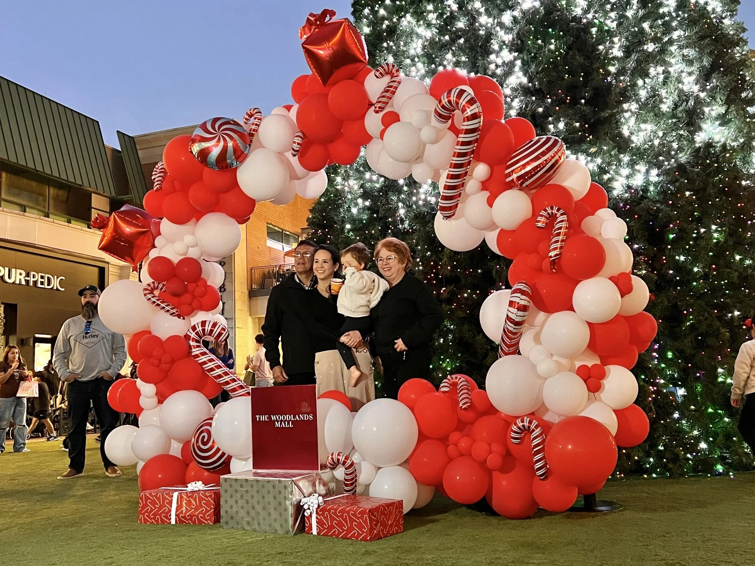 Christmas balloon arch in red and white with candy canes, The Woodlands