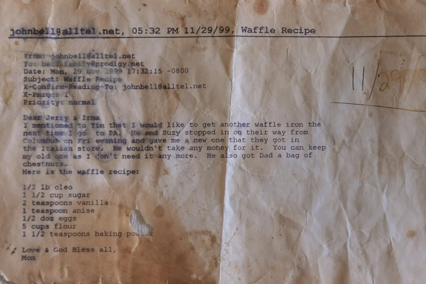 A crumpled, stained recipe paper titled 'Waffle Recipe' with handwritten notes. Contains cooking ingredients and instructions, including eggs, flour, sugar, vanilla, anise, and baking powder.