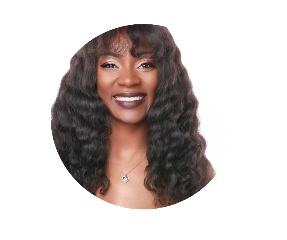 Smiling woman with dark, wavy hair and a heart-shaped necklace