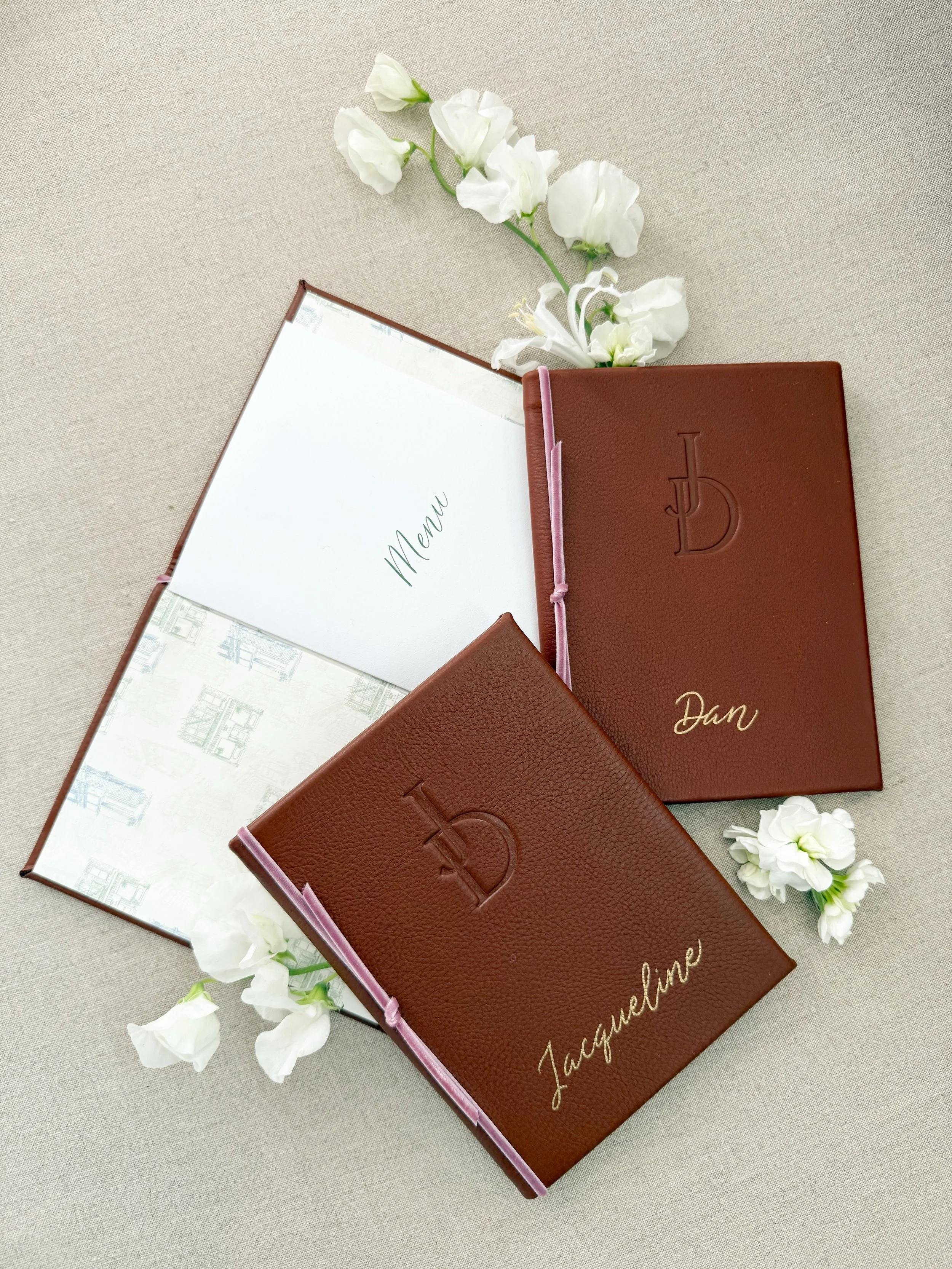 J + D&rsquo;s menus are among the most special and personal I&rsquo;ve ever created. We thoughtfully incorporated their love of restaurants with elegant touches and textures, creating beautiful, personalized menus that became a keepsake for their gue