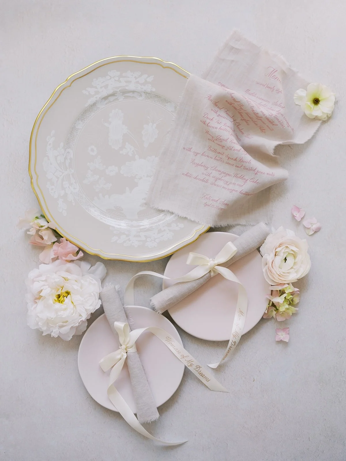 A moment for K + S&rsquo;s bespoke linen menus. They wanted to create an experience for their guests at the table and these custom menus were perfect. Each menu was tied with a bow with their guests&rsquo; nicknames hand calligraphed in rose gold foi