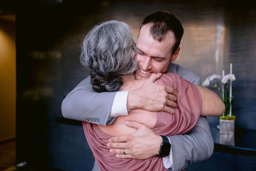 Groom Hugging Mom