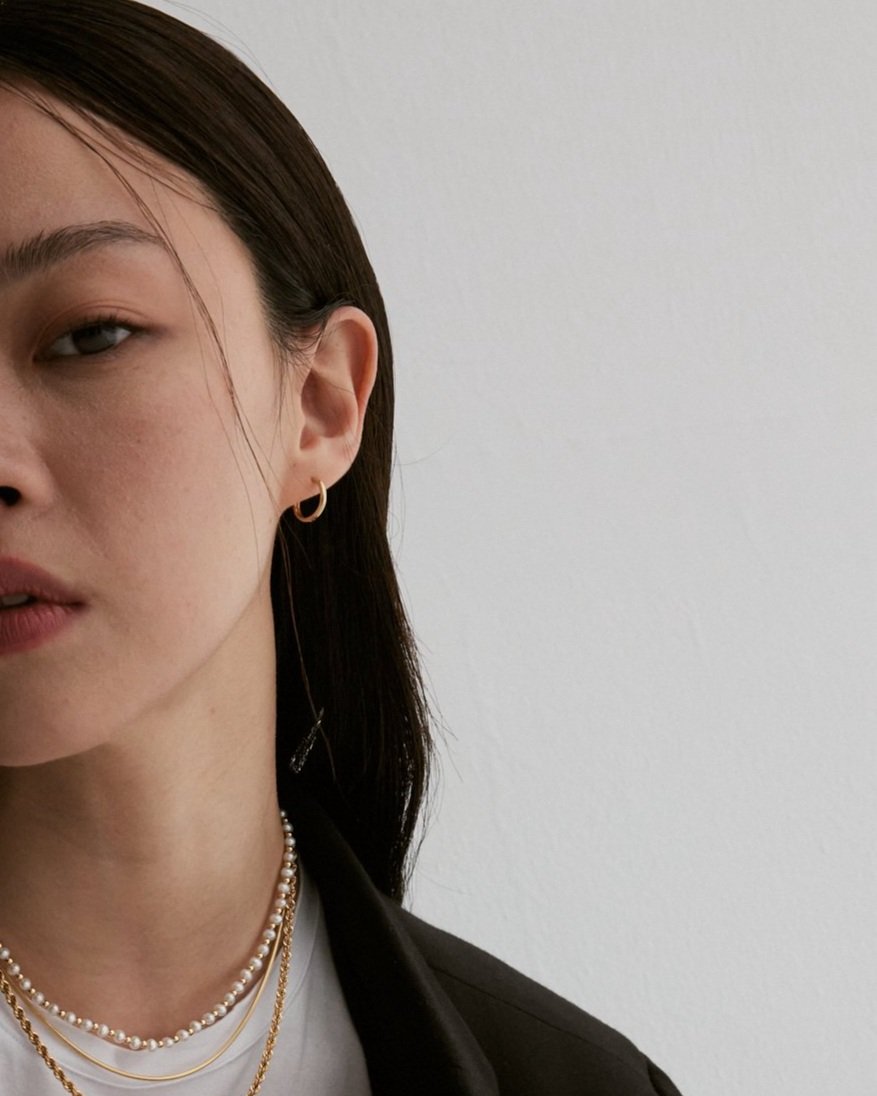 Maïwenn petite hoop huggies. 14K Solid Gold fine jewelry.