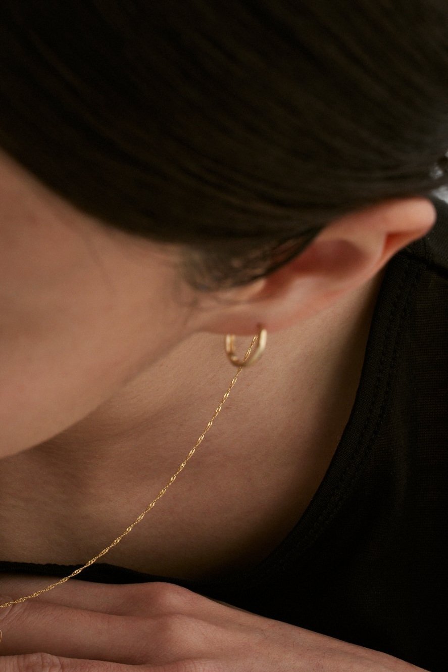 Maïwenn petite hoop huggies. 14K Solid Gold fine jewelry.