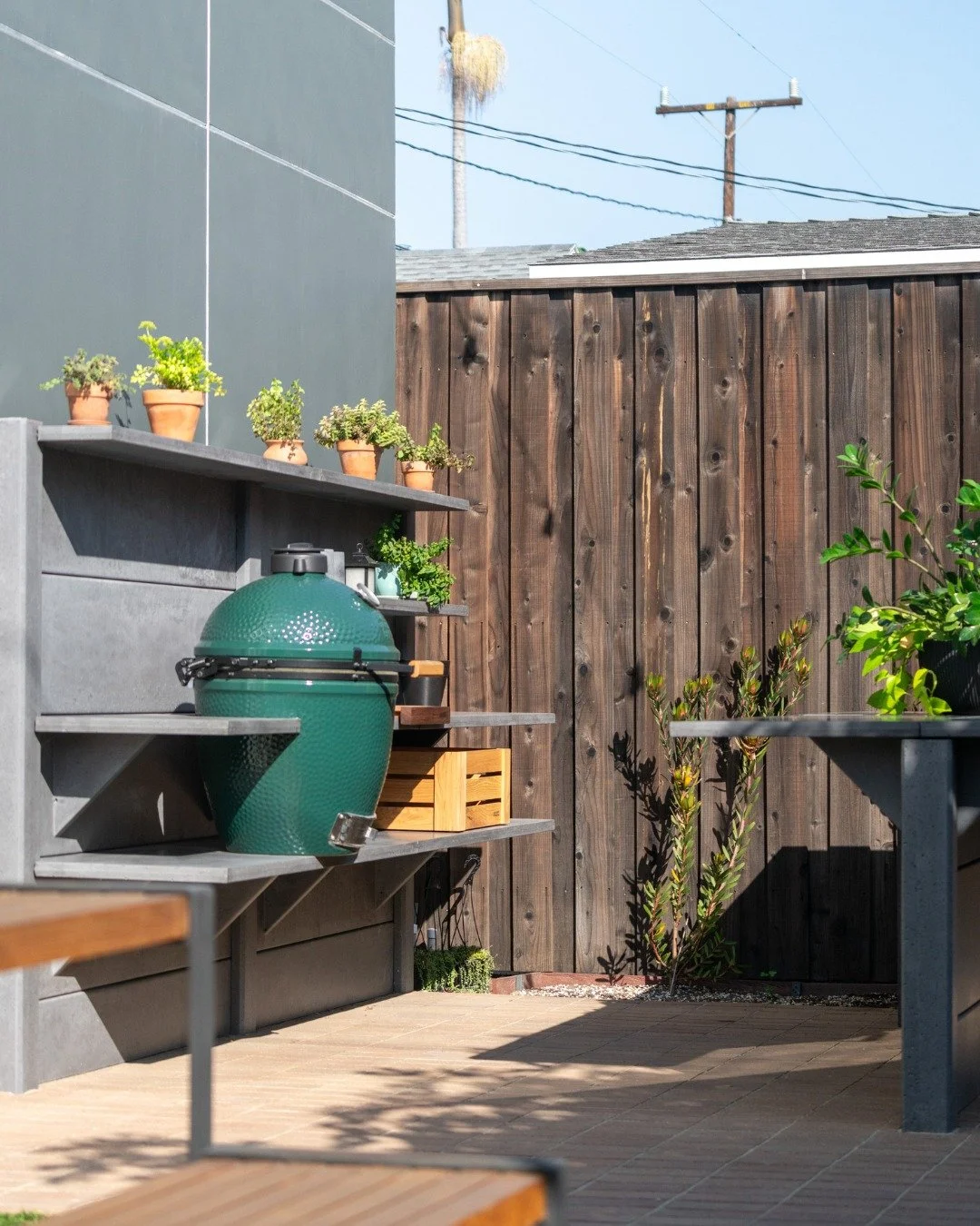 This family of four in Marina del Rey, California transformed an overlooked corner of their garden into a functional, elegant outdoor space. The custom WWOO Concrete Outdoor Kitchen, finished in a soft in-between shade of light and dark gray, perfect