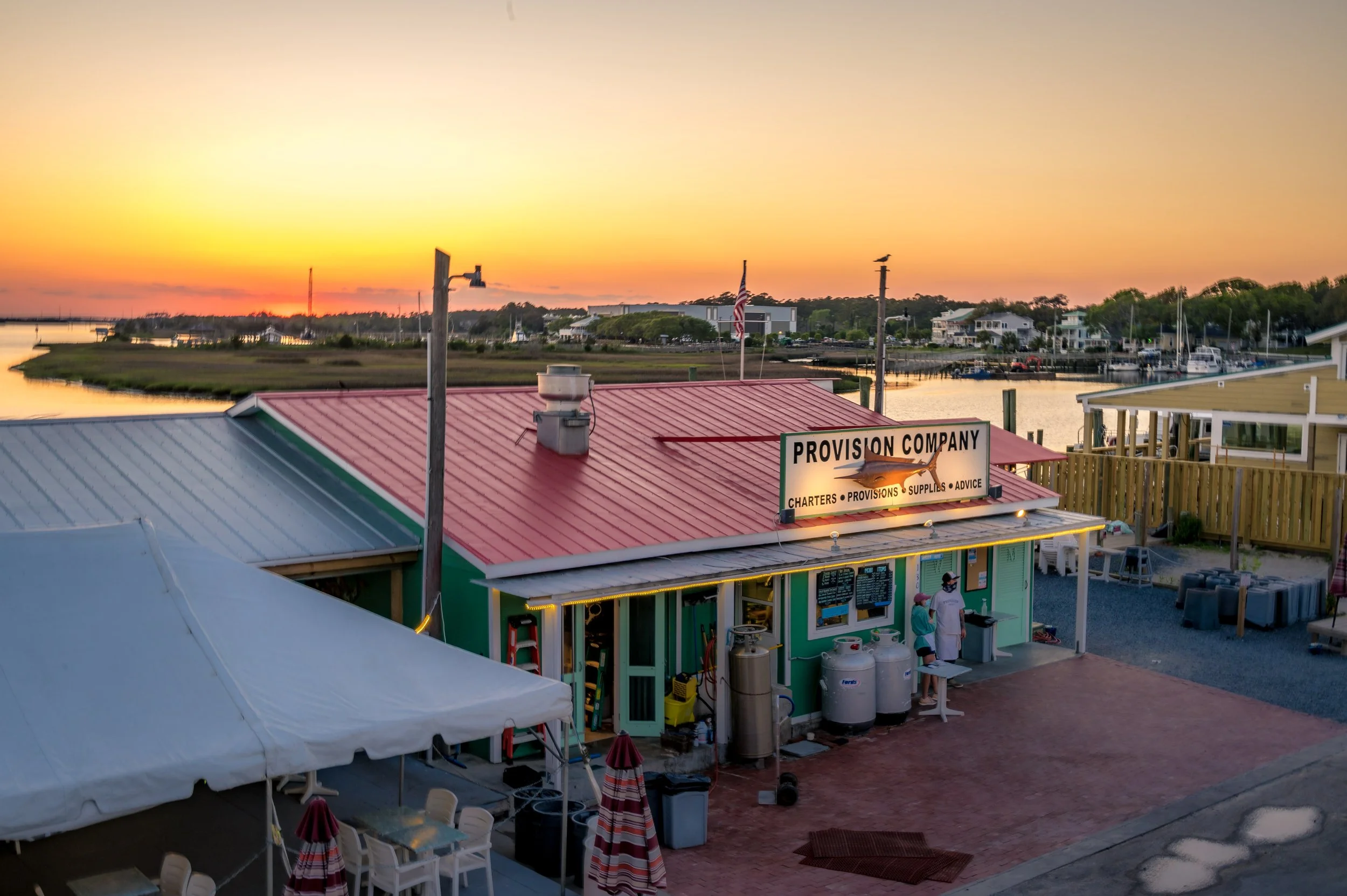 Outdoor waterfront dining at Provision Company in Southport, North Carolina, located just minutes from Oak Island.
