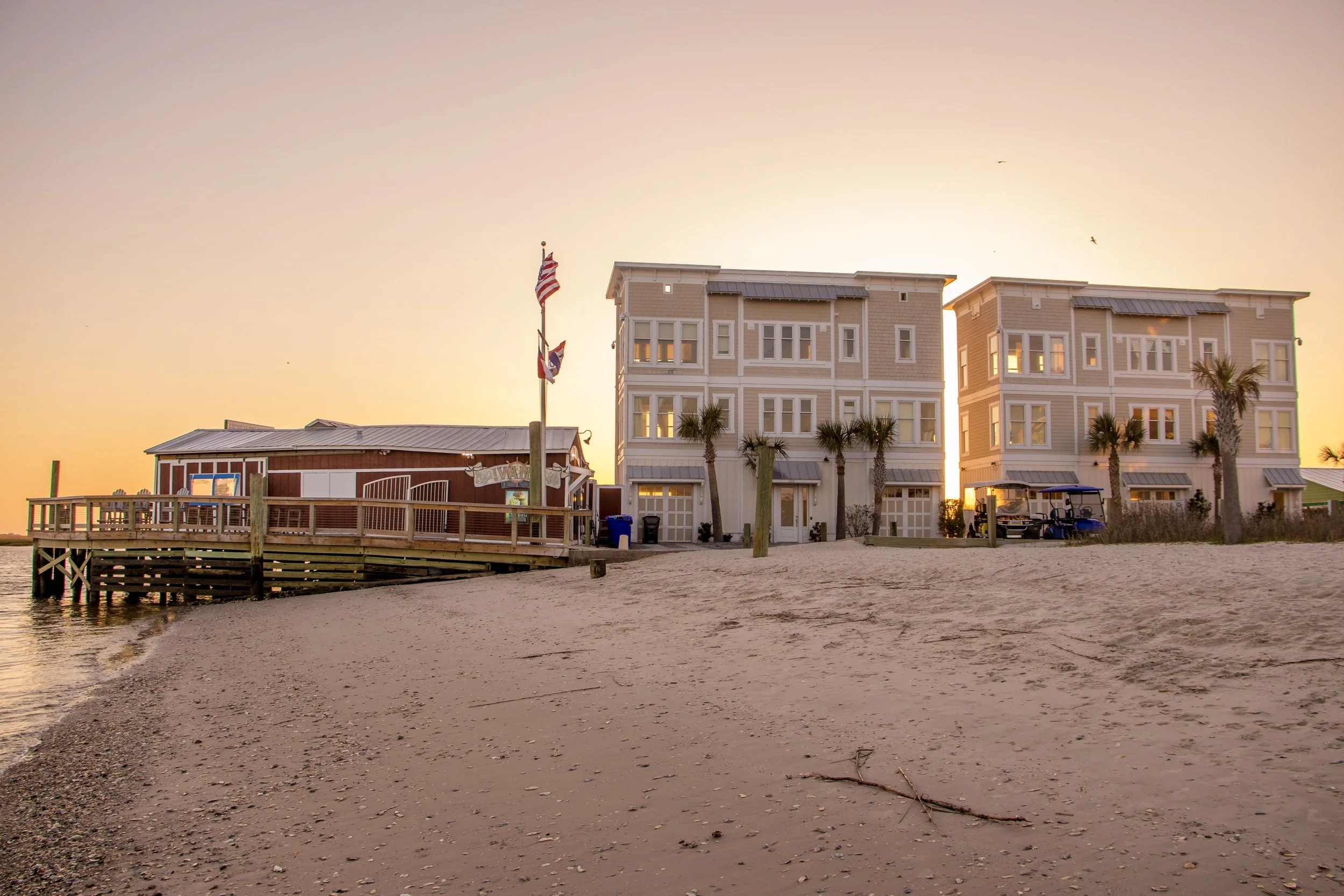 Sunset view of the Southport waterfront overlooking American Fish Company and the Cape Fear River.