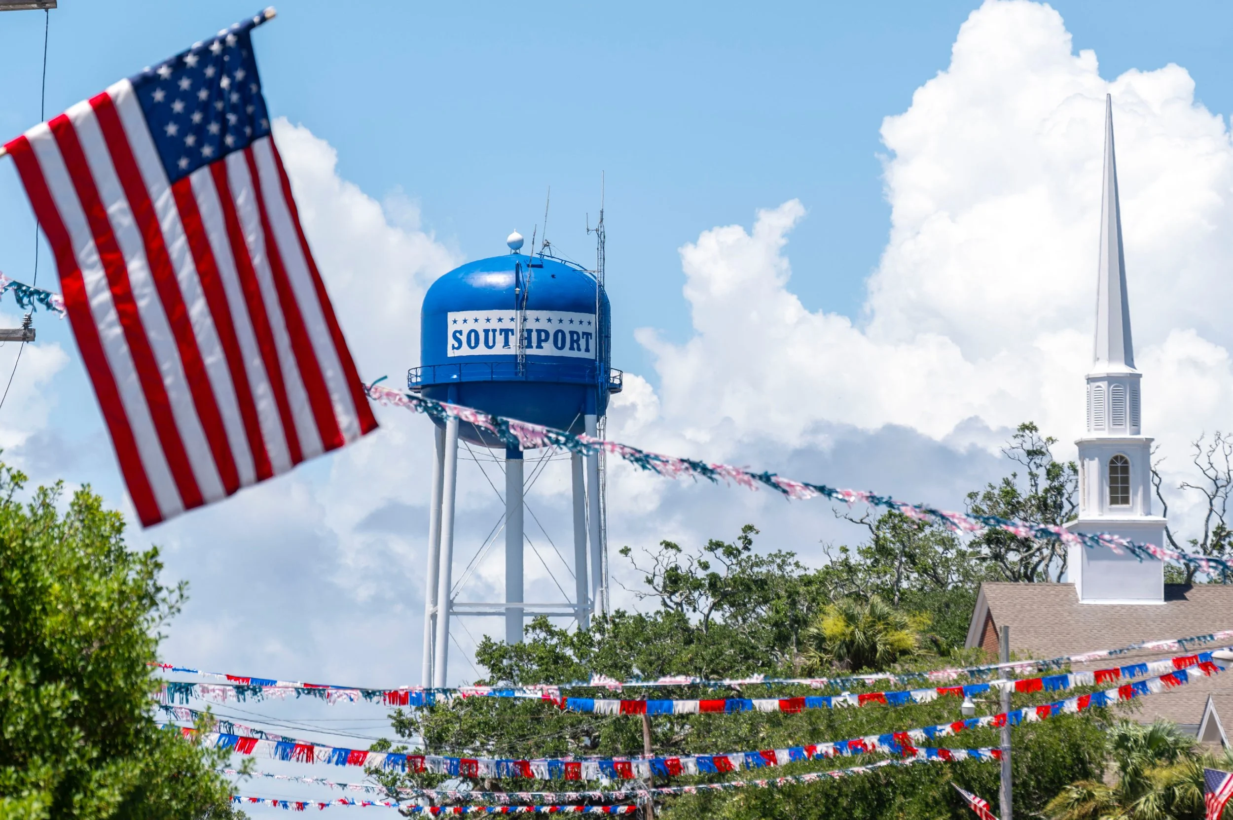American flags and patriotic decorations line the streets of downtown Southport during the North Carolina Fourth of July Festival.