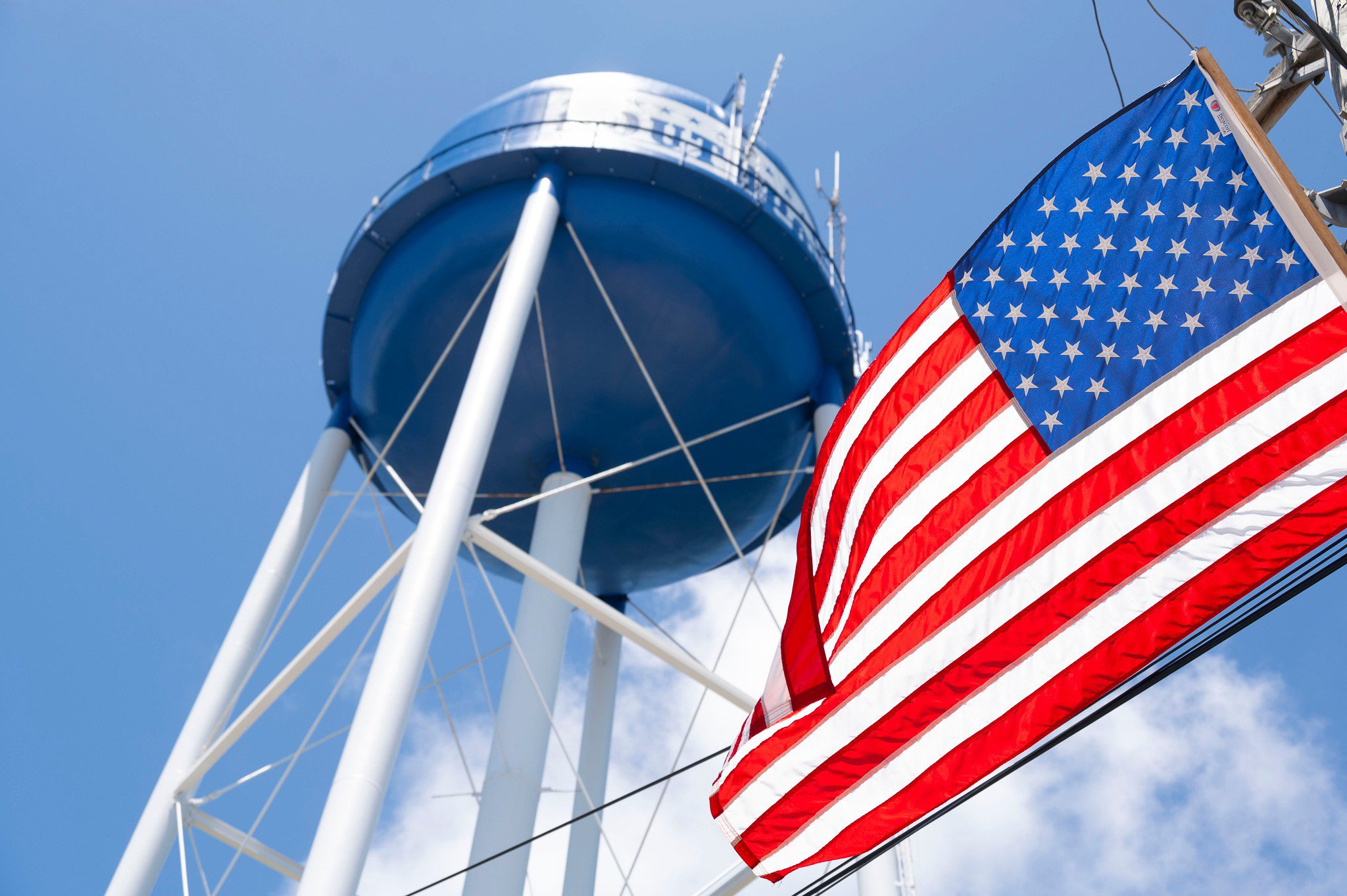 American flag flying beside the Southport water tower during the North Carolina Fourth of July Festival.