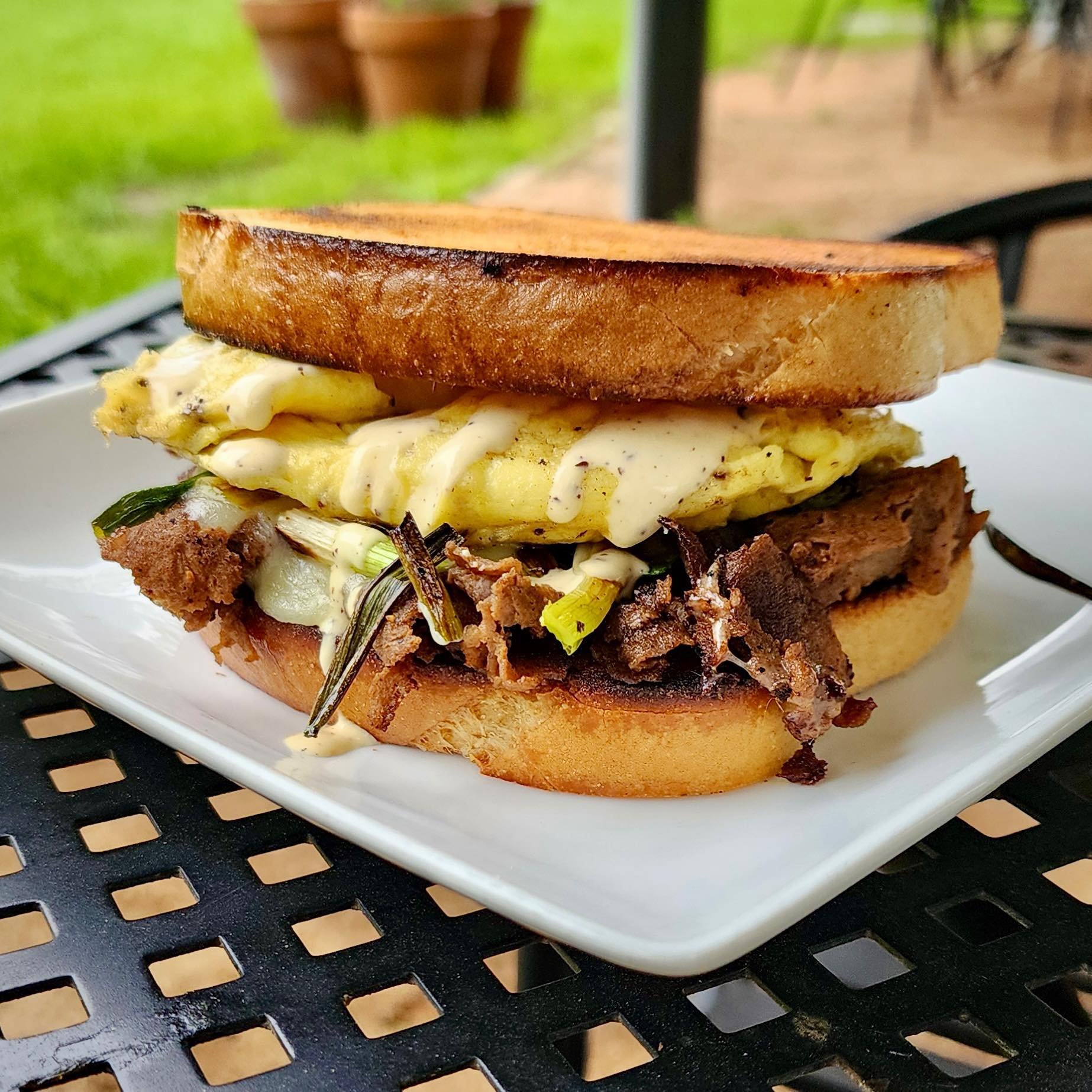✨Steak and Egg Sandwoch✨
We were in the mood for steak and eggs this week!! 🥩🍳🍞 Two scrambled eggs topped with thinly sliced ribeye seared with southwest seasoning, sharp white cheddar, charred green onions, and habanero crema, all on toasted sour