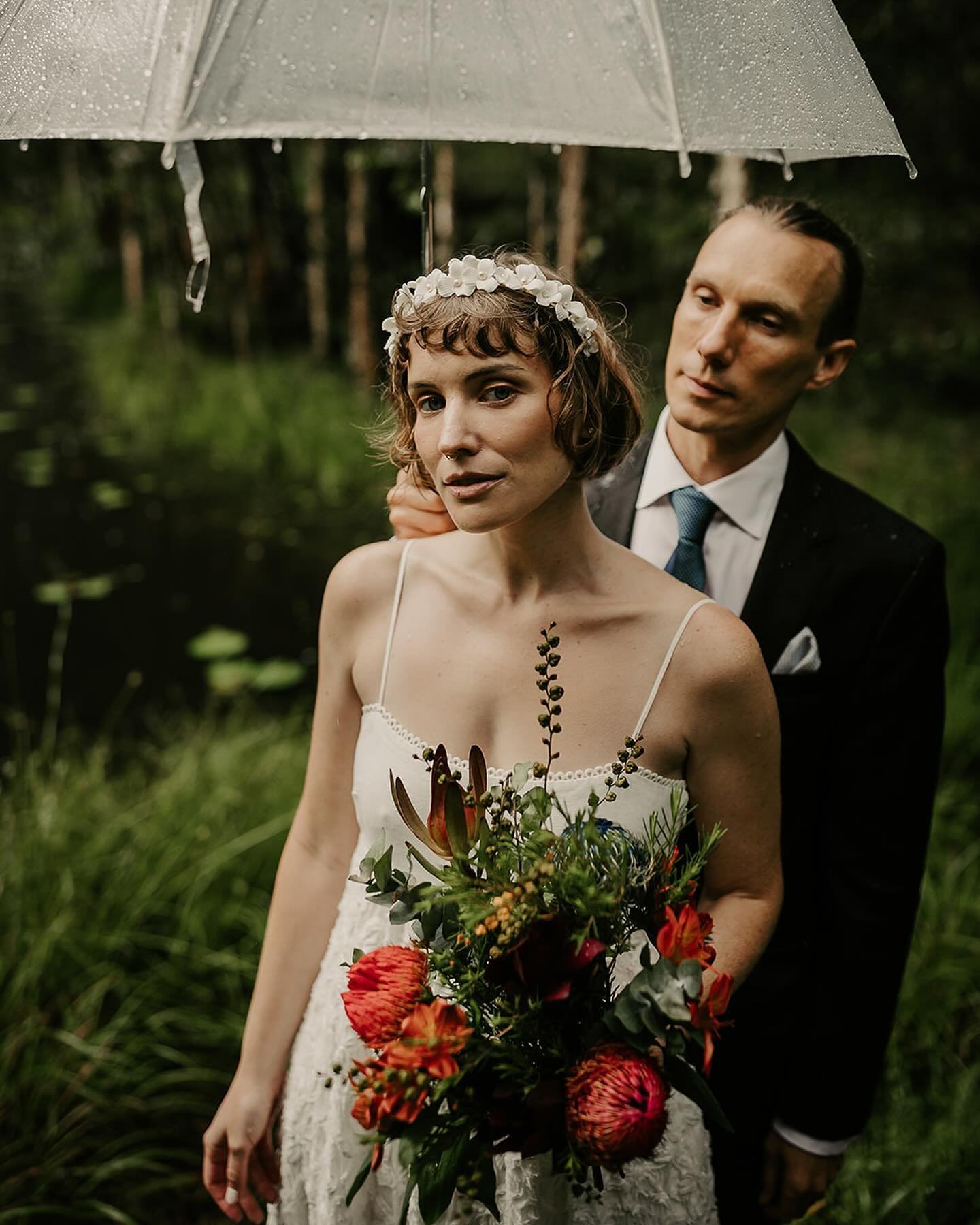 ~ Hannah &amp; Robert ~ 

Rain on your wedding day may not always be welcome but I simply love the energy it can bring. These two embraced it in their stunning forest setting for their elopement. Congrats guys. 

Celebrant @love.withrin 
Dress @alema