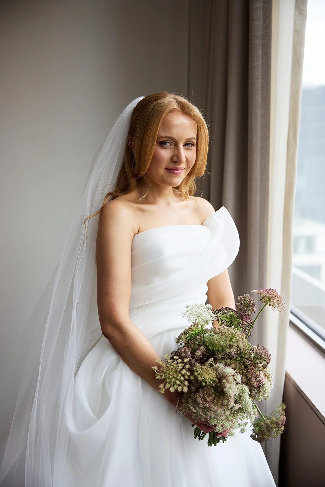 Chelsea preparing to put on her Maria Hardwick wedding dress