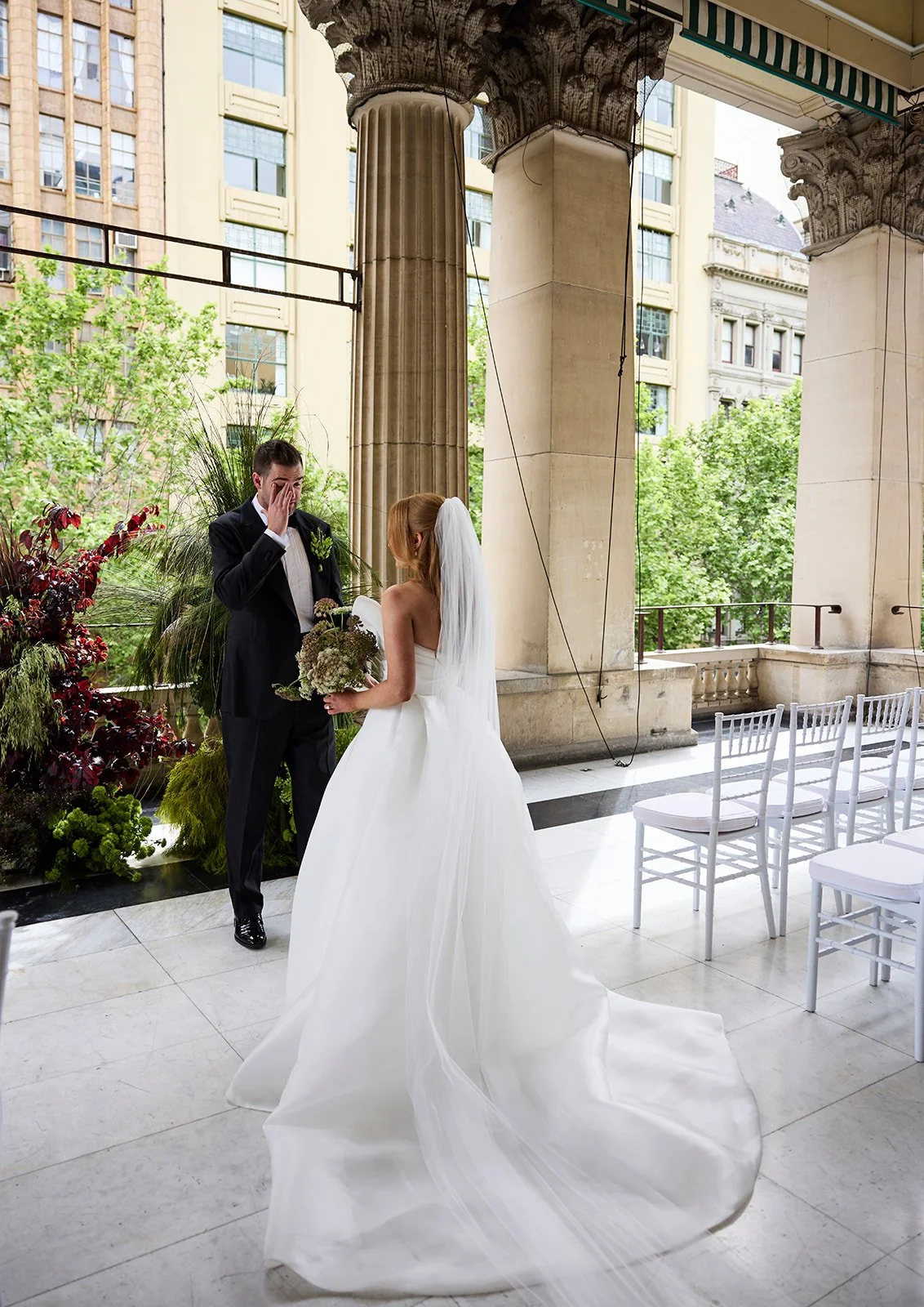 Emotional first look between Chelsea and Henry on the balcony of Melbourne Town Hall.