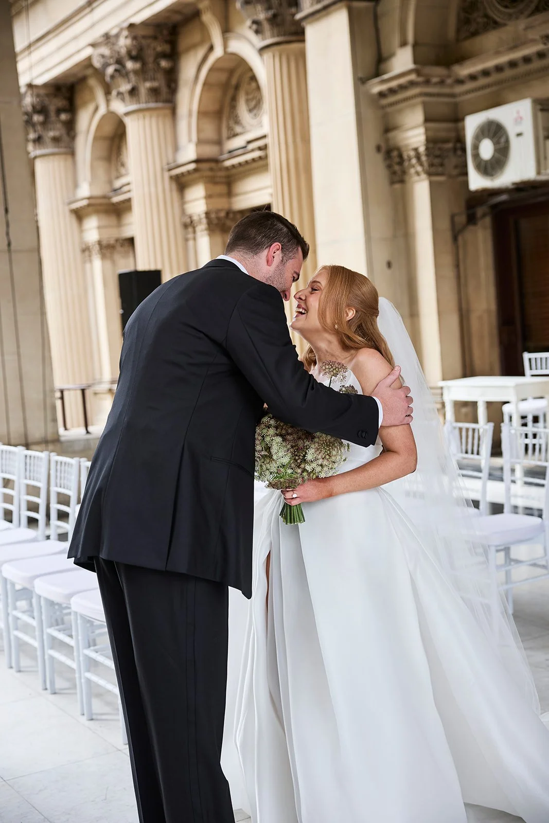 Bride and groom enjoying a quiet first look before their Melbourne CBD wedding ceremony.