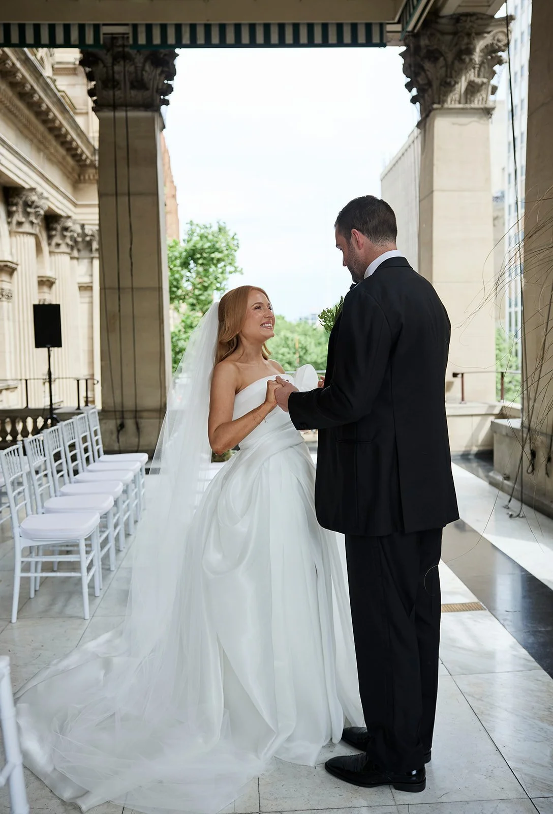 Chelsea and Henry’s intimate first look surrounded by the heritage architecture of Melbourne Town Hall.