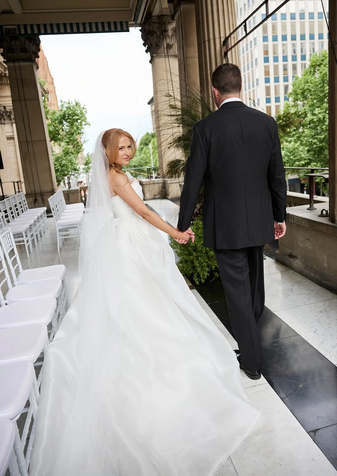 Groom Henry seeing bride Chelsea for the first time on their wedding day at Melbourne Town Hall.