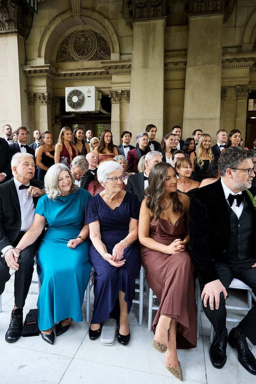 Wedding guests react emotionally as Chelsea and Henry exchange vows at Melbourne Town Hall.