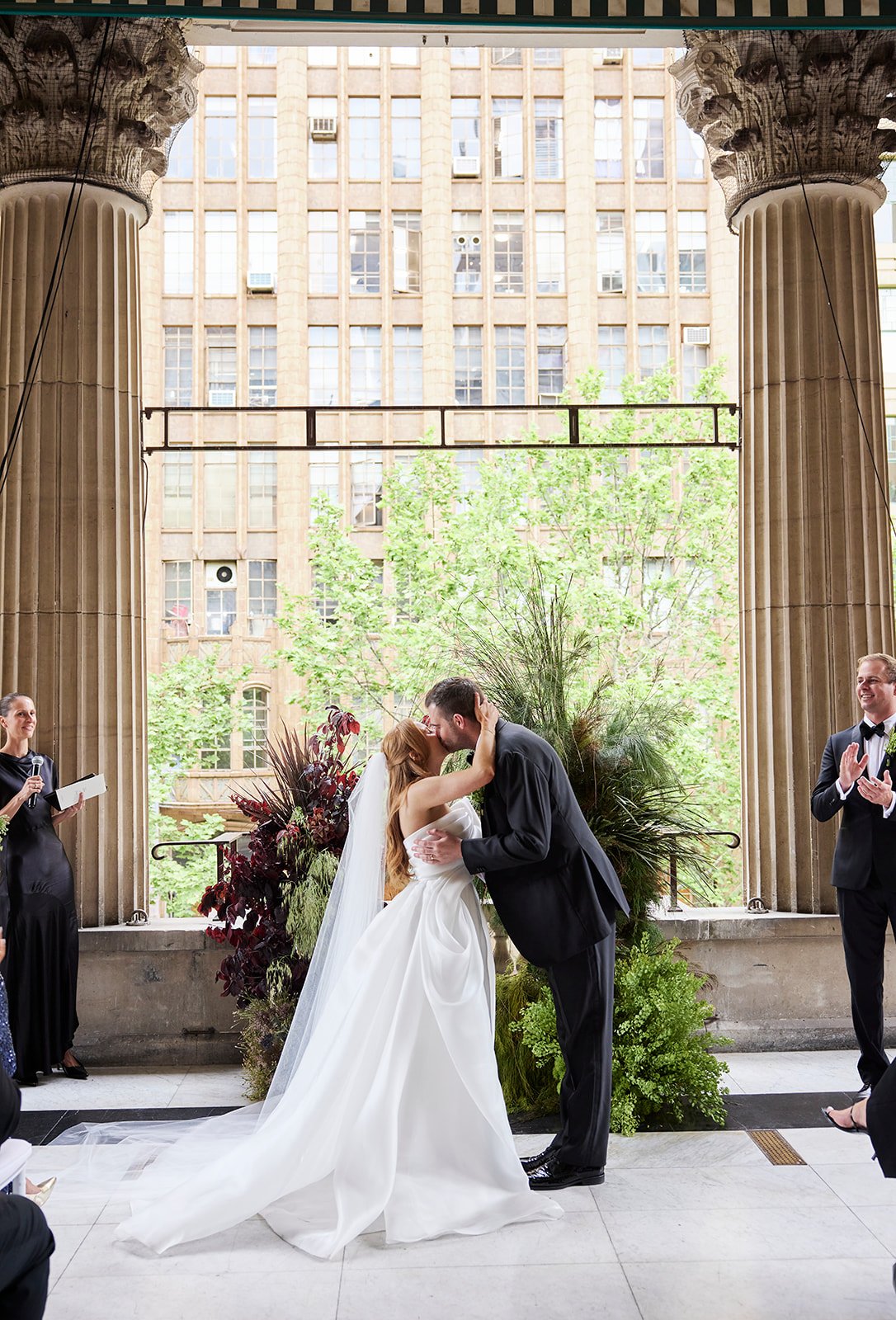 Chelsea and Henry share a heartfelt kiss after saying “I do” at Melbourne Town Hall.