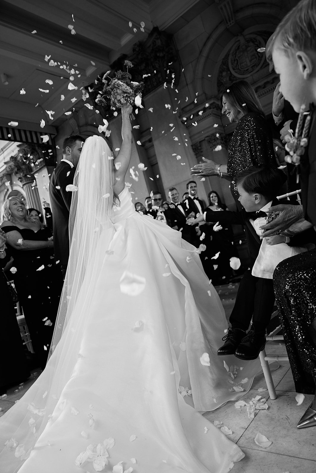 Confetti fills the air as Chelsea and Henry walk back down the aisle as newlyweds