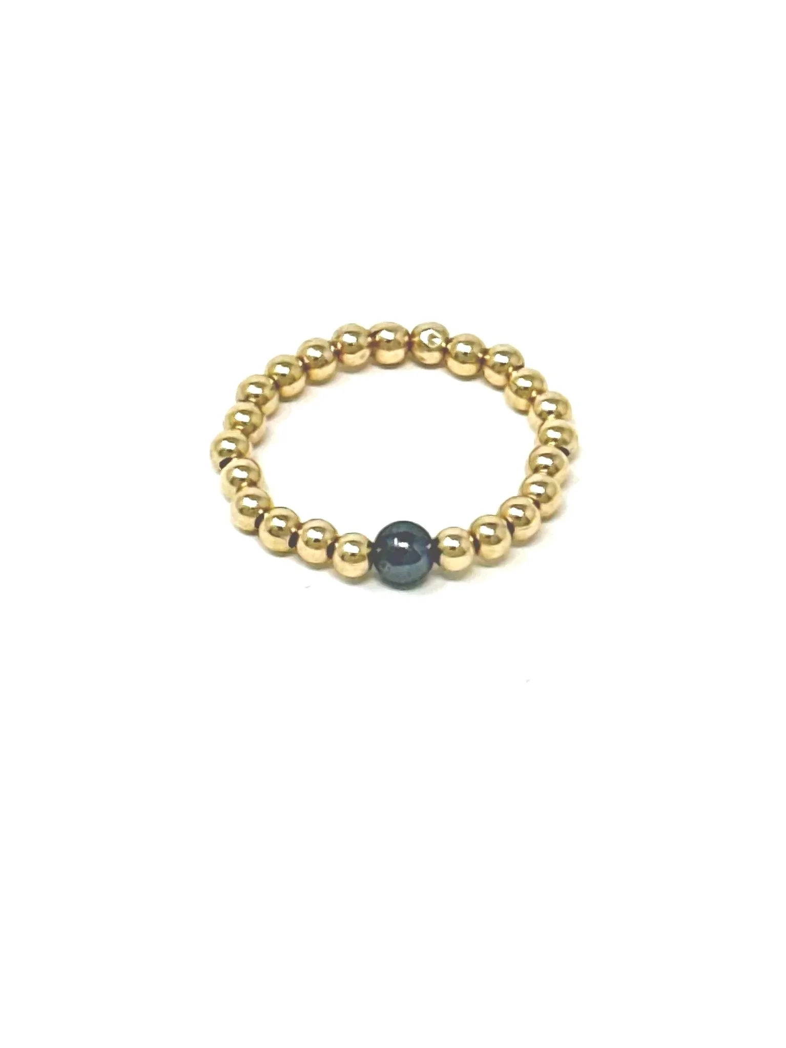 Stretchy Hematite Ring with a natural hematite stone at the center, surrounded by tiny 14K gold fill or sterling silver beads. Handmade, stackable, and lightweight.