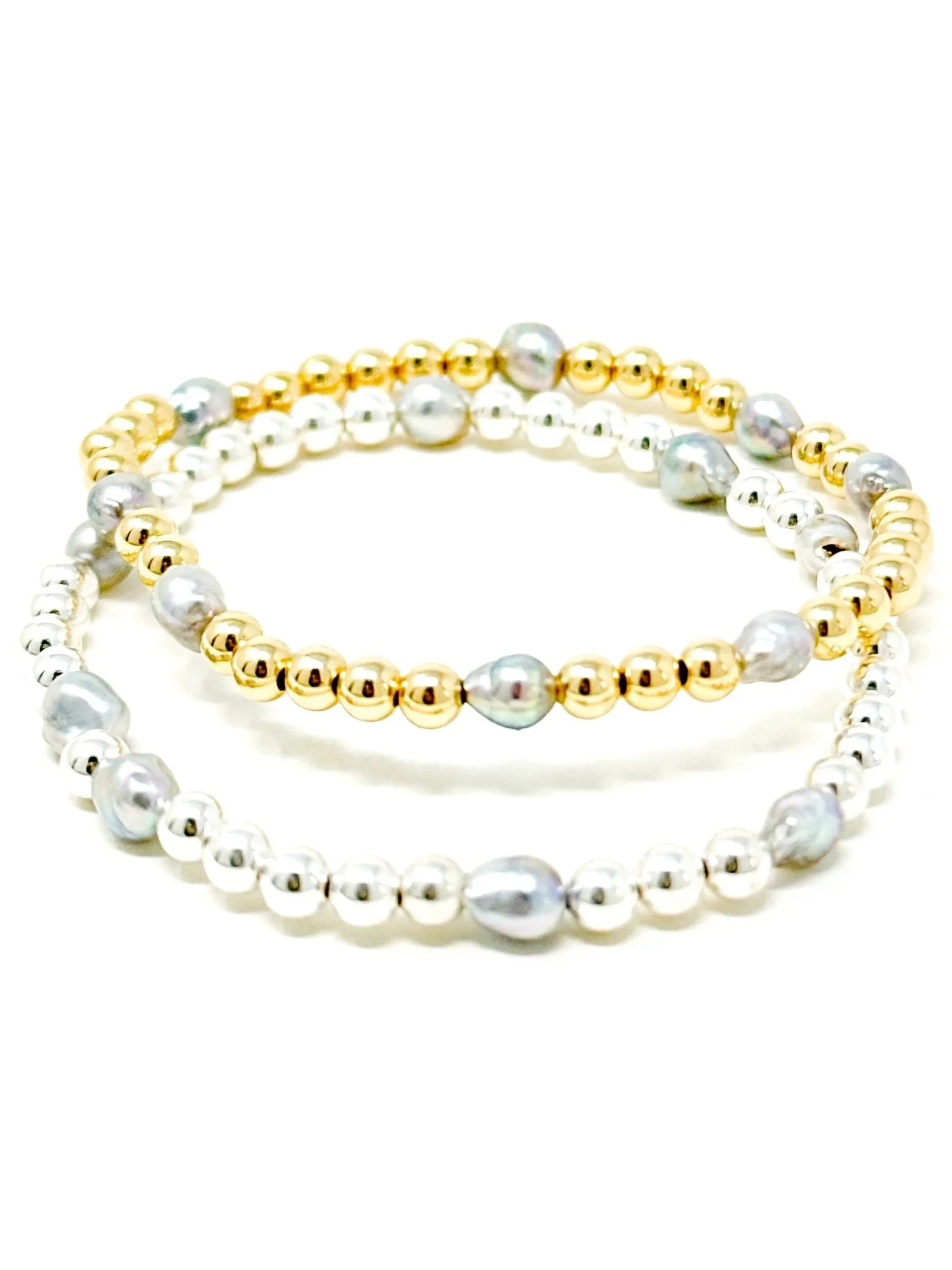 Handmade stretchy pearl bracelet featuring light silver Akoya pearls with subtle blue shimmer, accented with gold fill or sterling silver. Ideal for stacking, layering, or gifting.