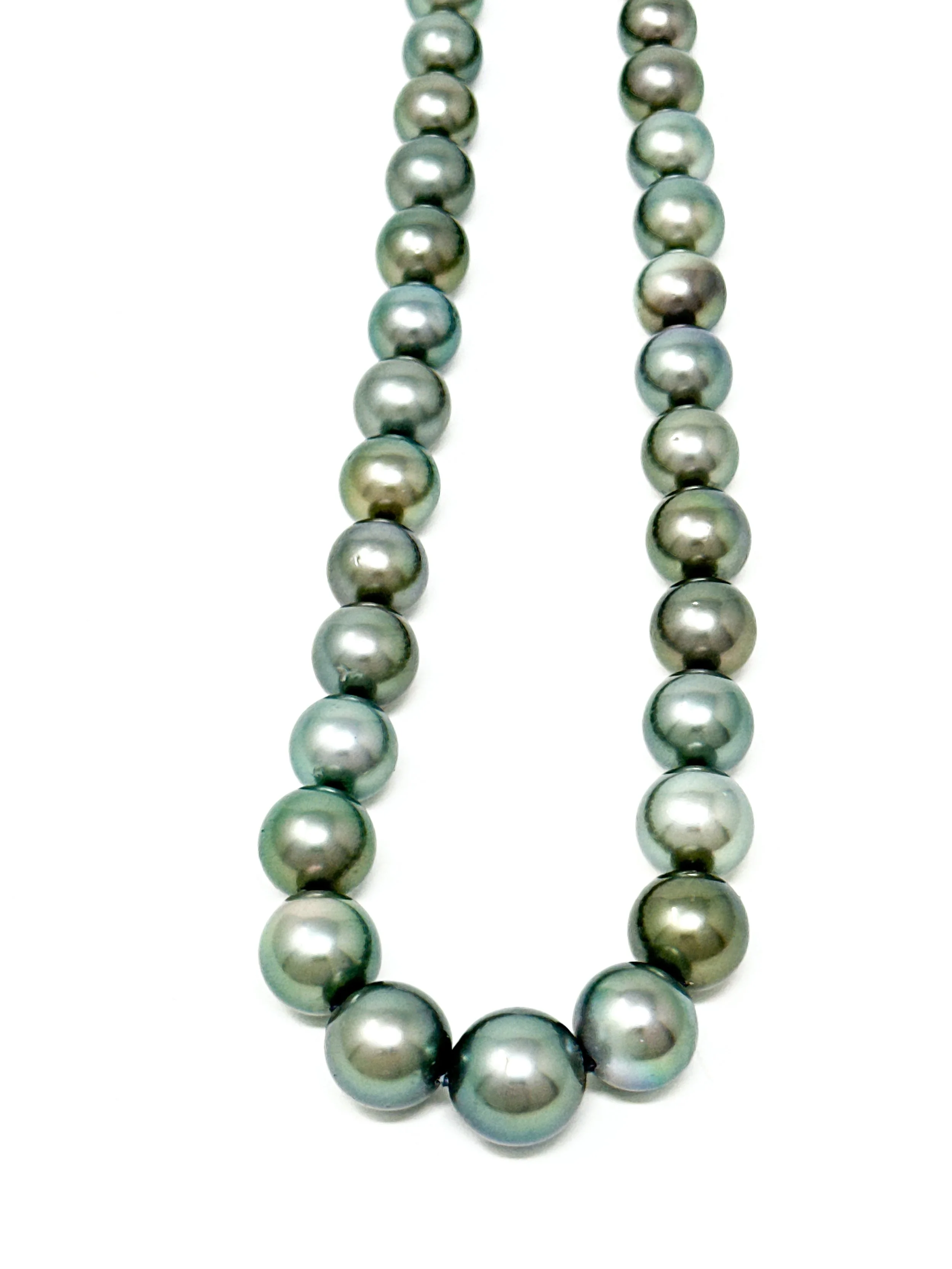 Larger 14mm Tahitian pearls within strand showing natural organic shape and silvery glow