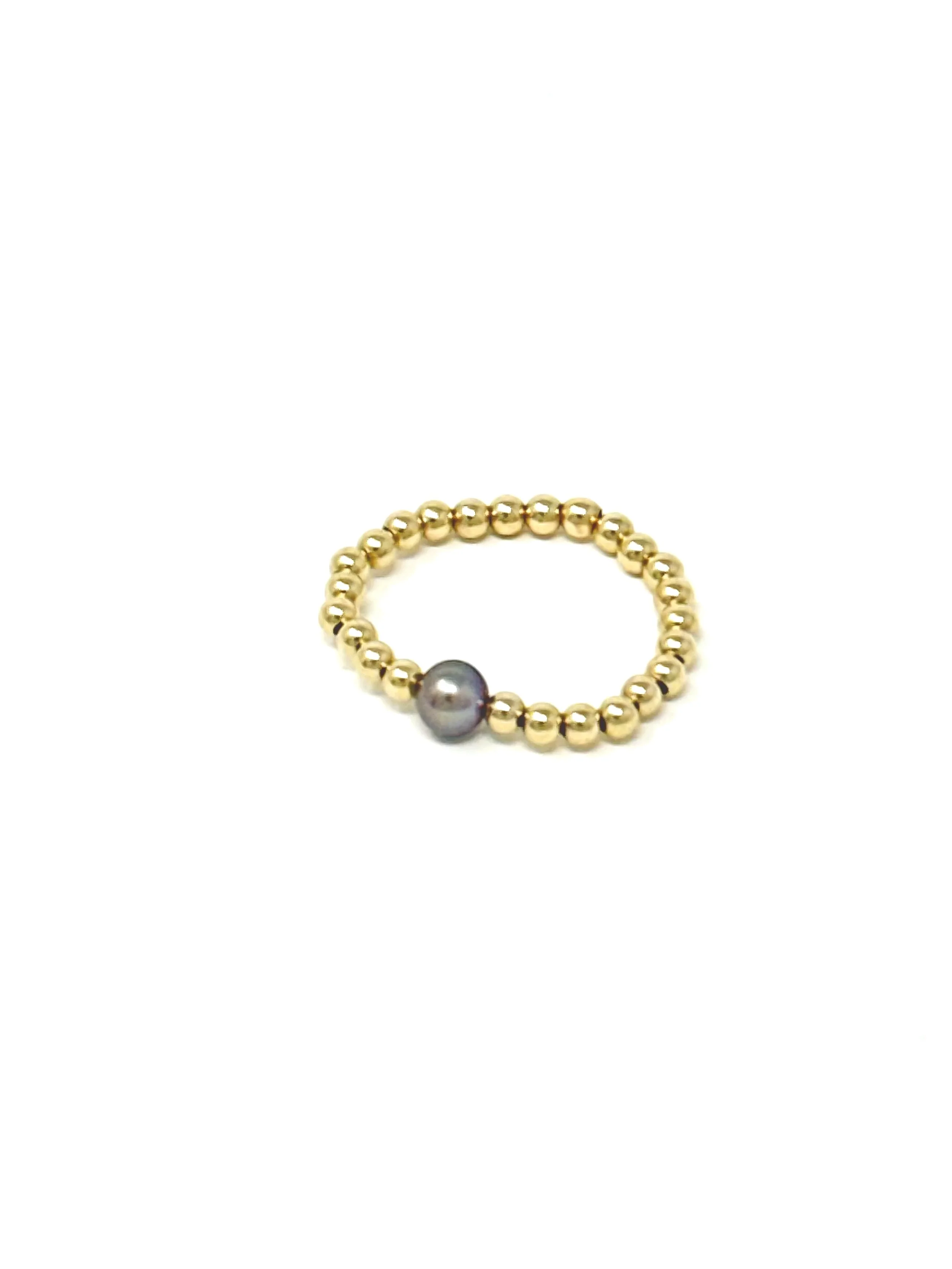 Handmade Stretchy Edison Keshi Pearl Ring with single dark pink-mauve pearl surrounded by tiny beads. Dainty, versatile, and ideal for everyday wear or layering.