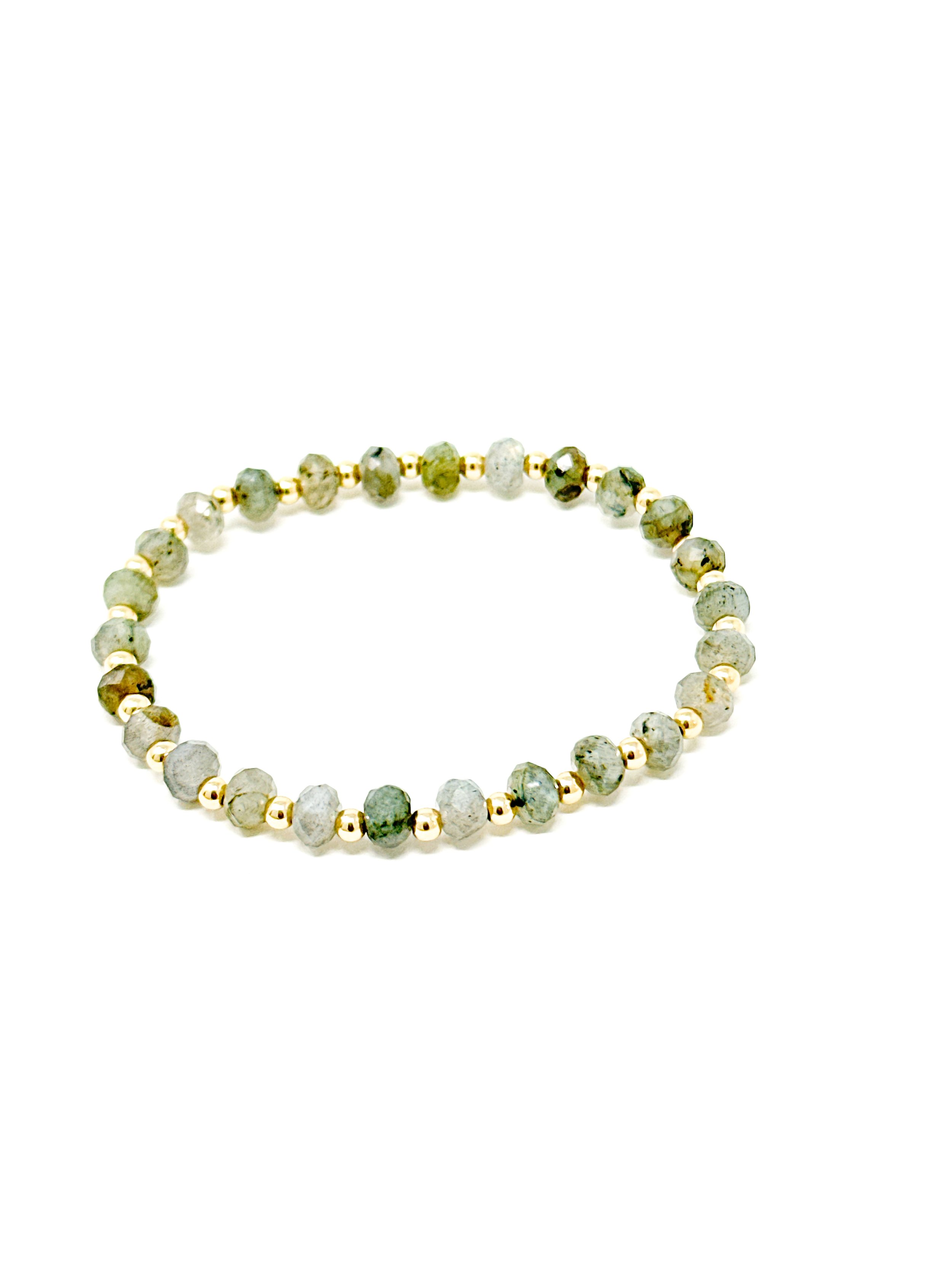 Faceted blue flash labradorite stretchy bracelet with 14K gold fill or sterling silver beads. Handmade, stackable, and luminous gemstone jewelry.