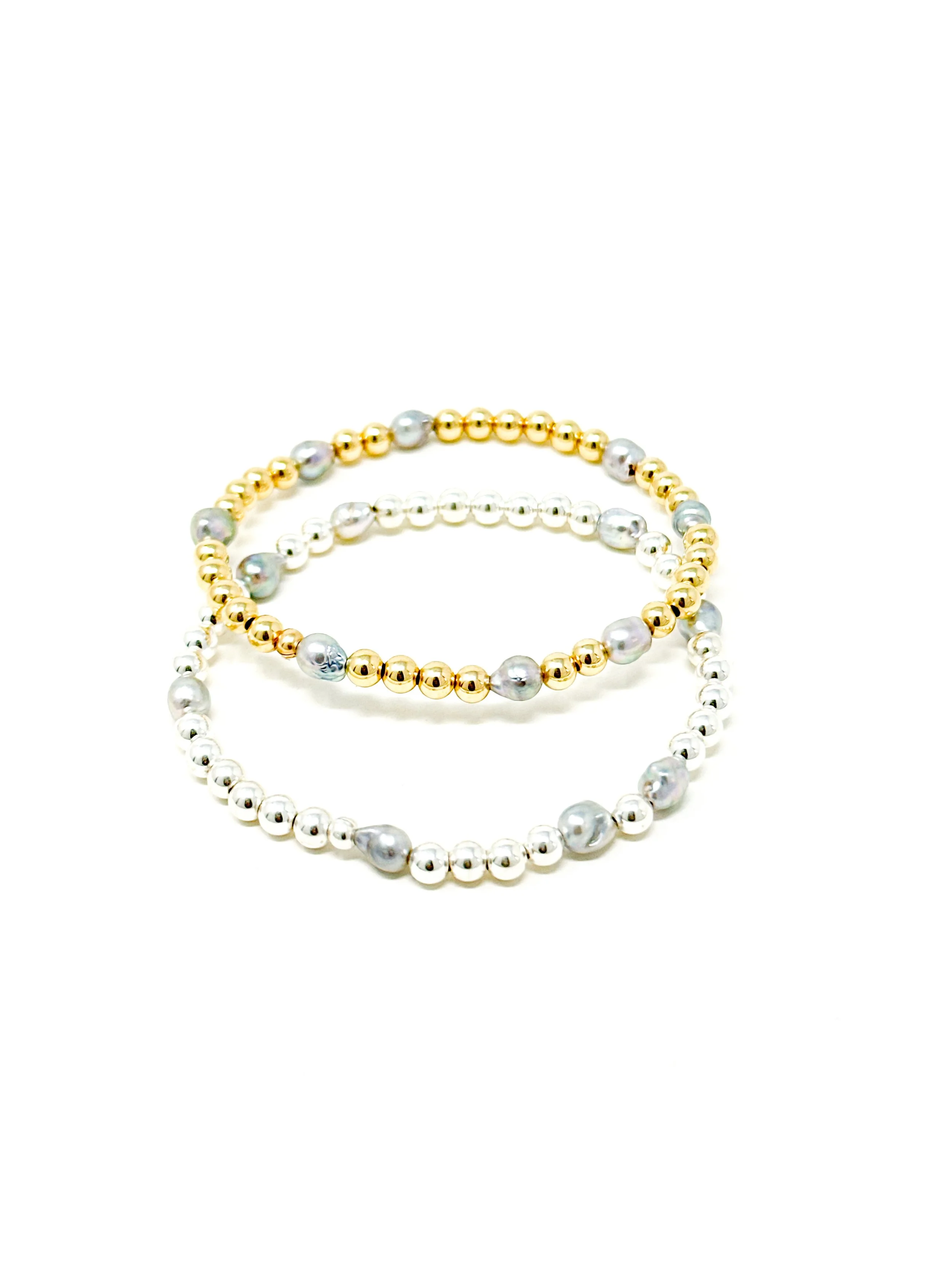Elegant Keshi Akoya pearl bracelet in light silver with soft blue overtones. Stretchy, lightweight, and stackable with 14K gold fill or sterling silver beads.