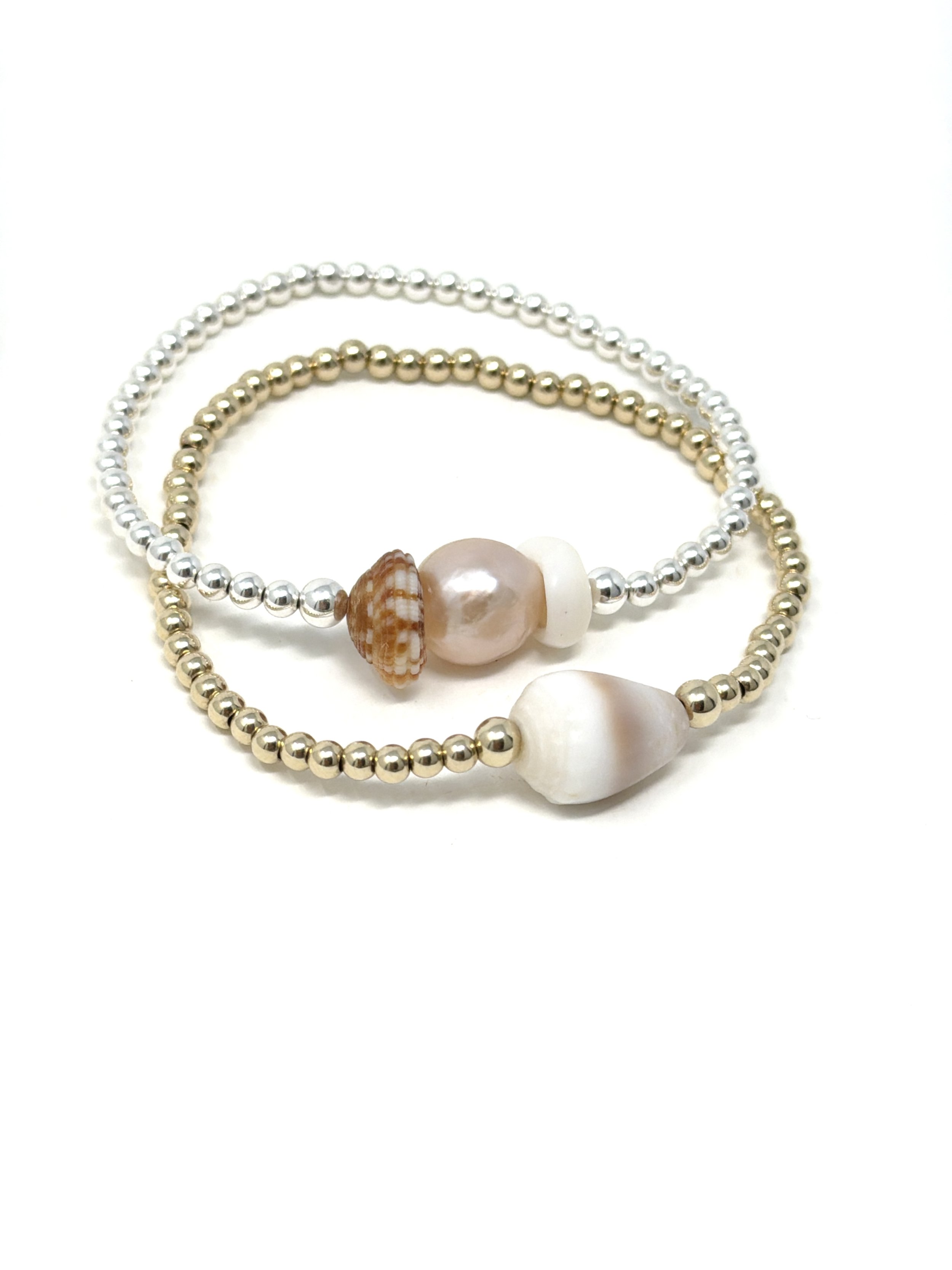Ocean-inspired pearl and shell bracelet with 9mm pink Edison pearl centerpiece. Handmade, stretchy, and accented with gold fill or sterling silver beads.